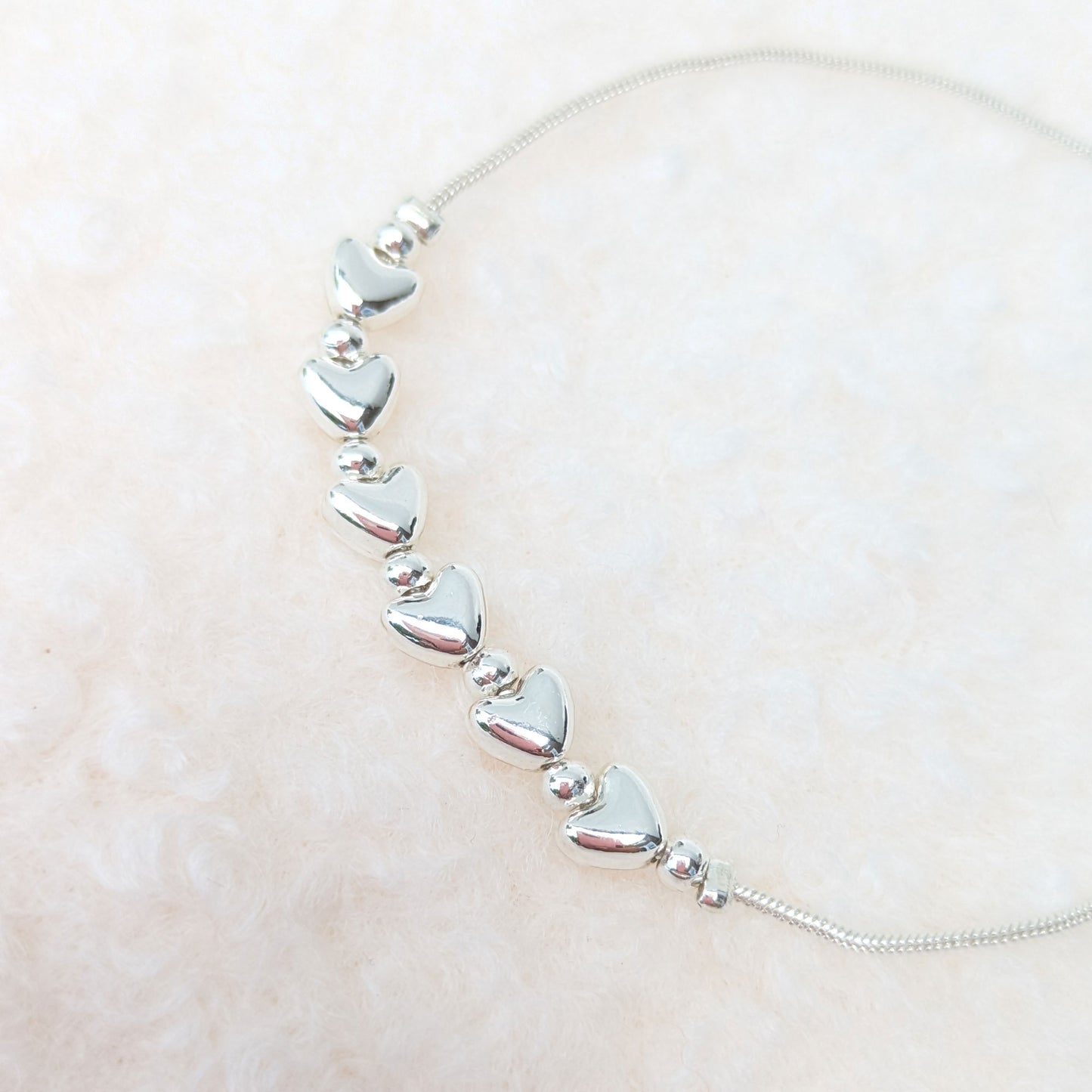 Silver plated hearts slider bracelet