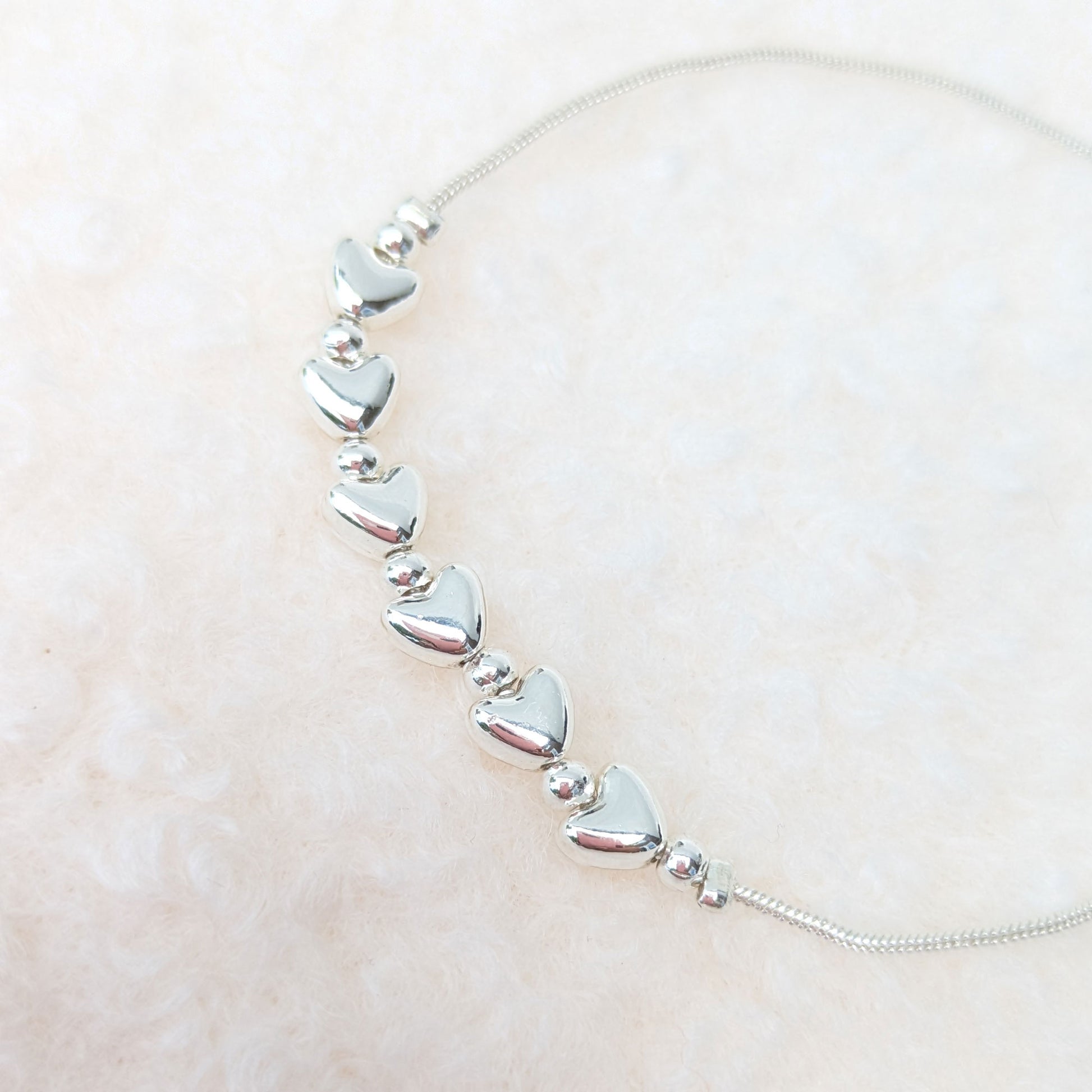 Silver plated hearts slider bracelet