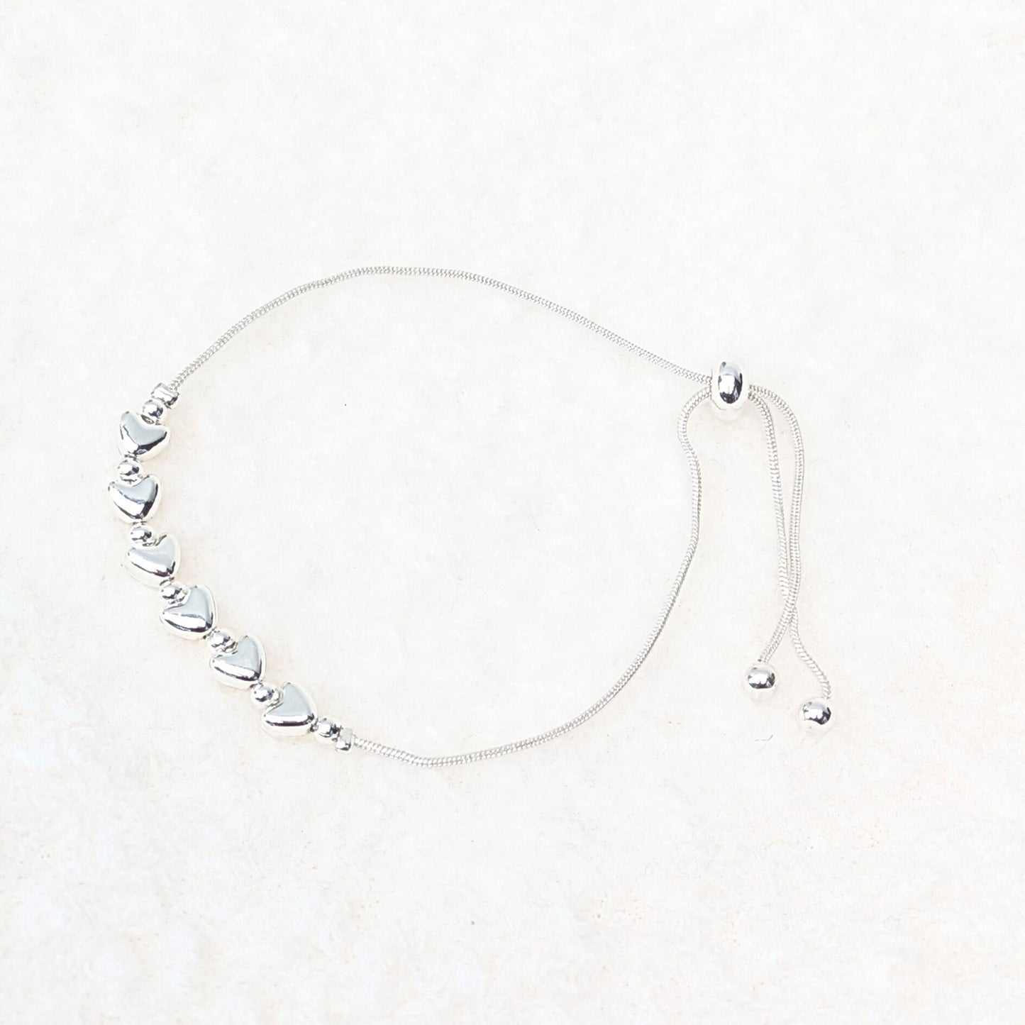 Silver plated hearts slider bracelet