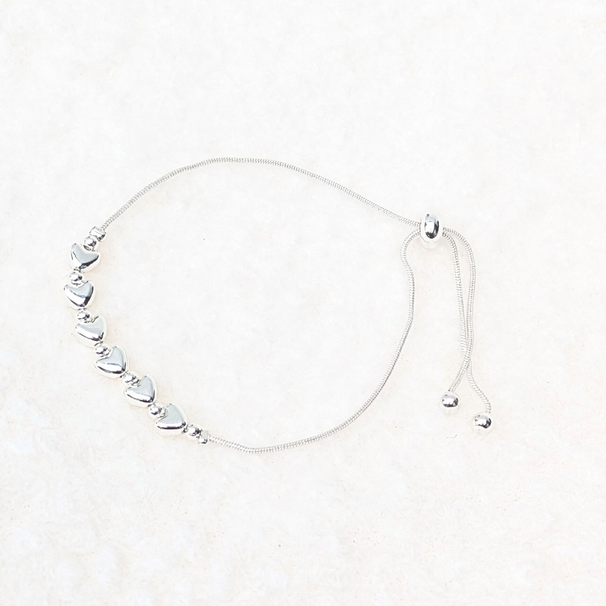 Silver plated hearts slider bracelet