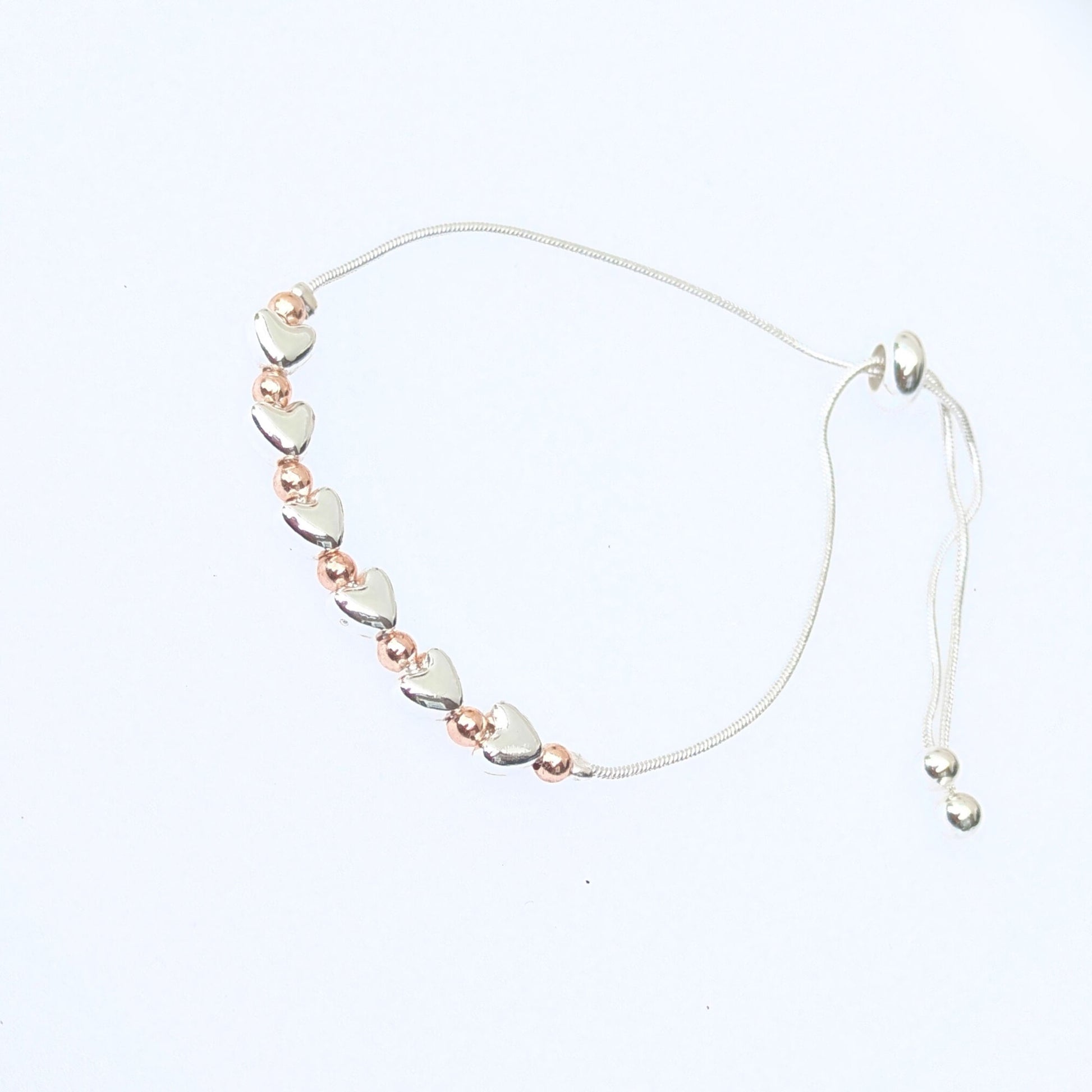 Silver and gold plated hearts slider bracelet