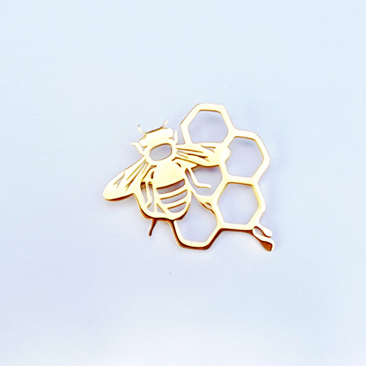 Bee and honeycomb brooch