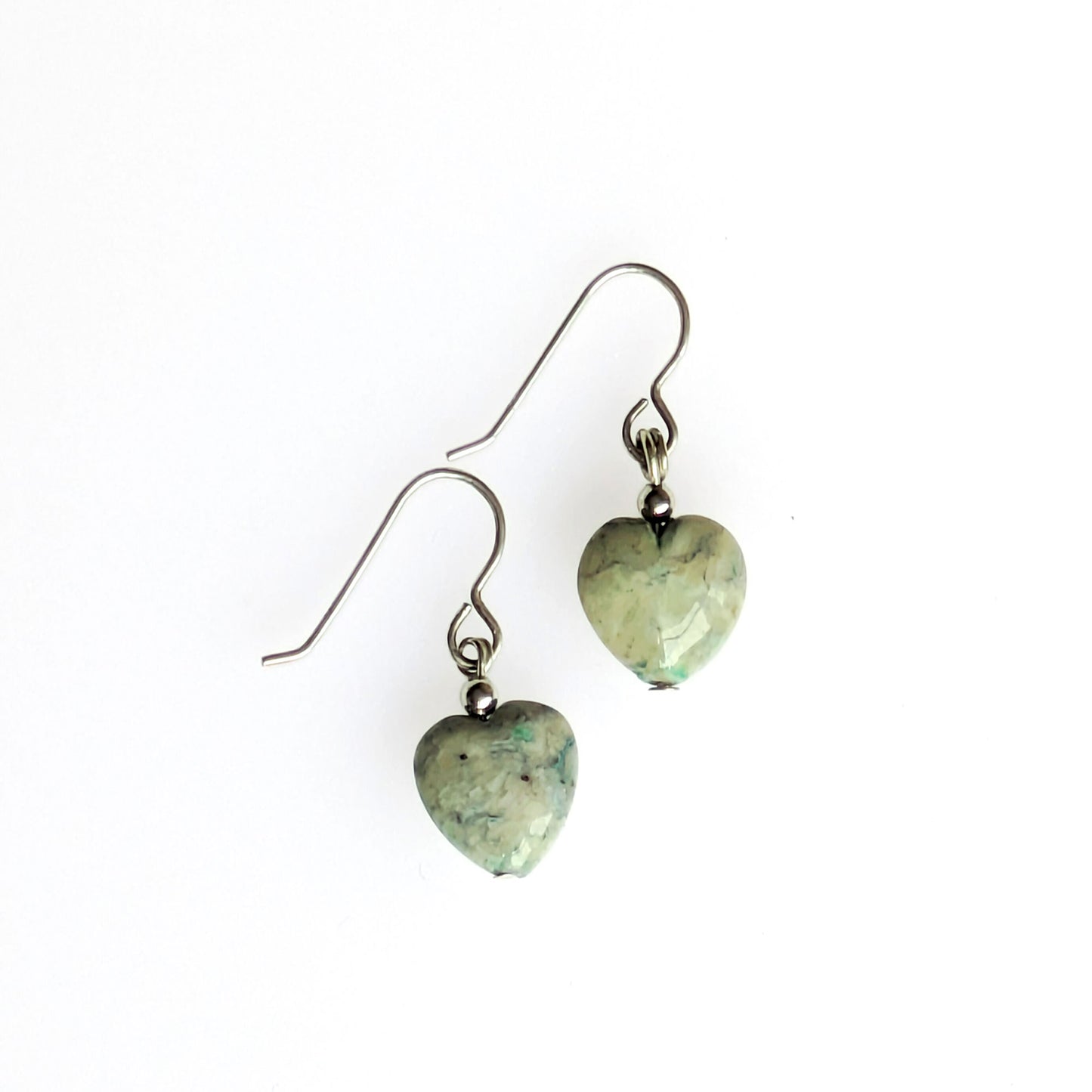 Green fossil heart earrings