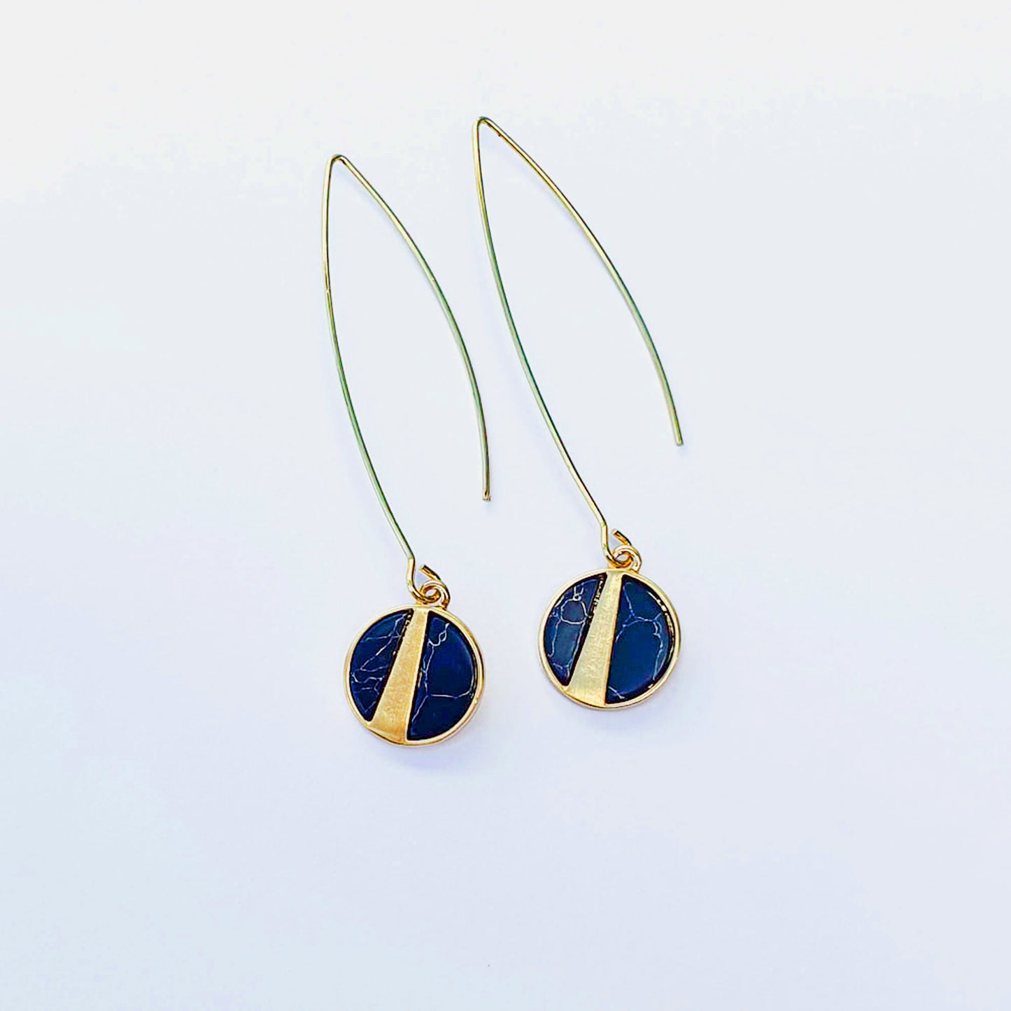 Marbled navy stone discs in gold plate on long oval earwires