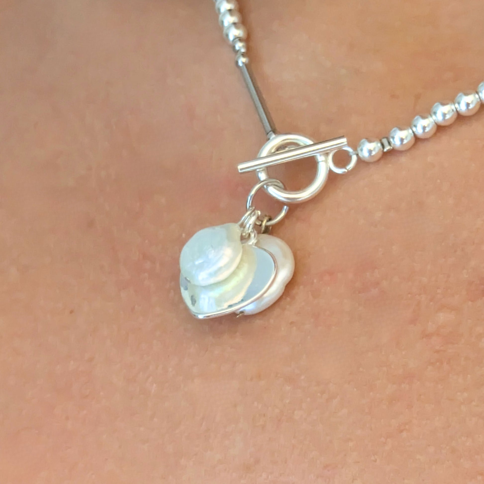 Freshwater coin pearl charms on silver plated hematine