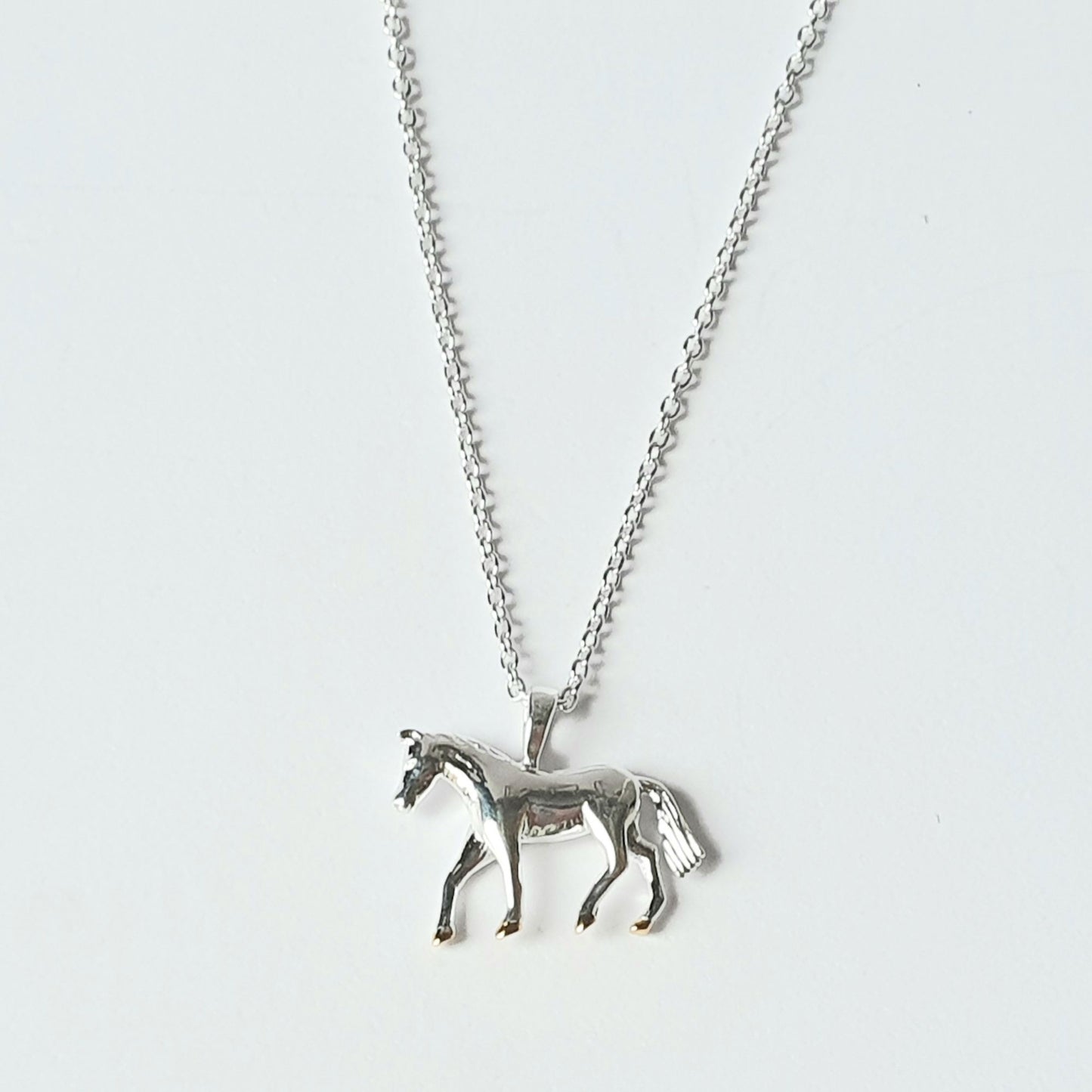 Sterling silver horse with gold vermeil hooves