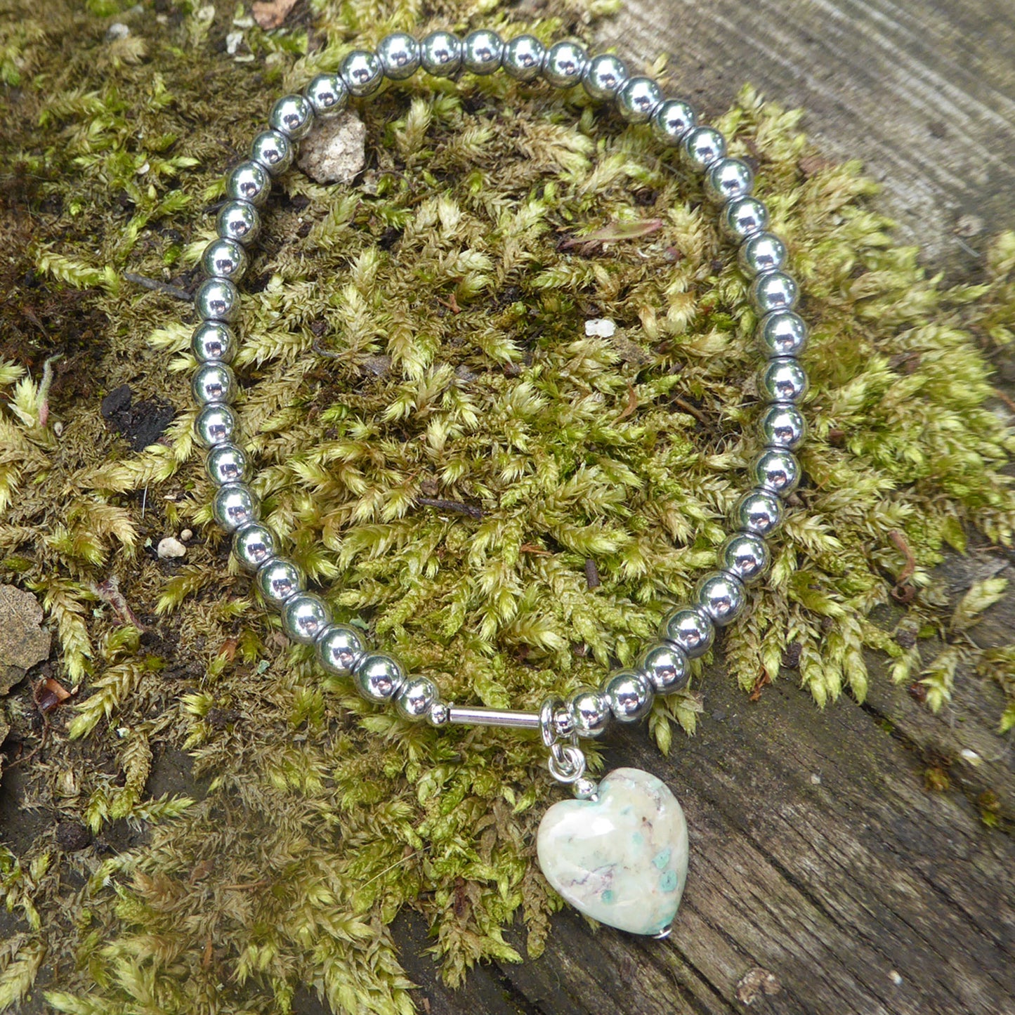 Green fossil heart charm bracelet