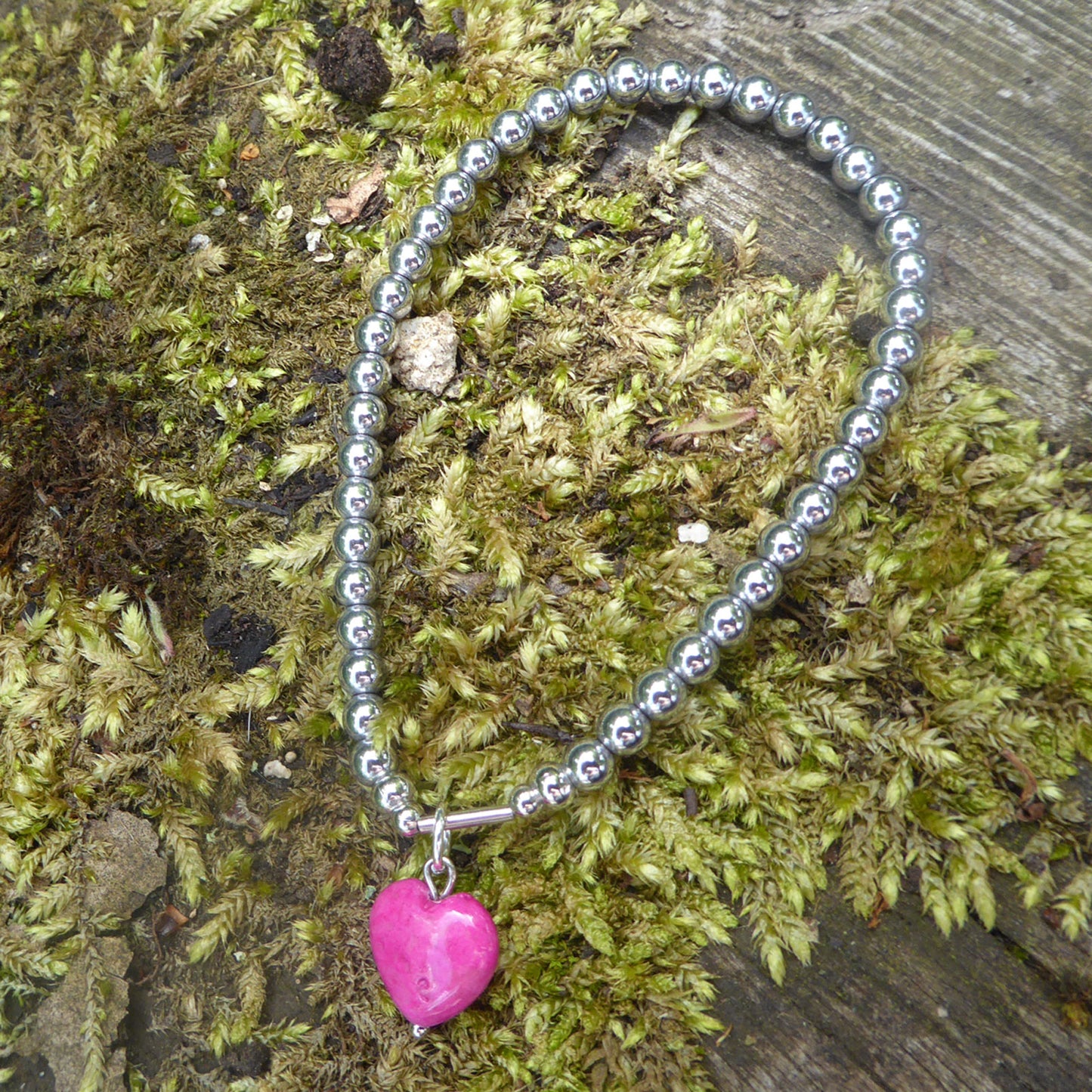 Hot pink fossil heart charm bracelet