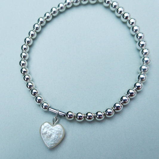 Freshwater pearl heart charm on silver plated hematine