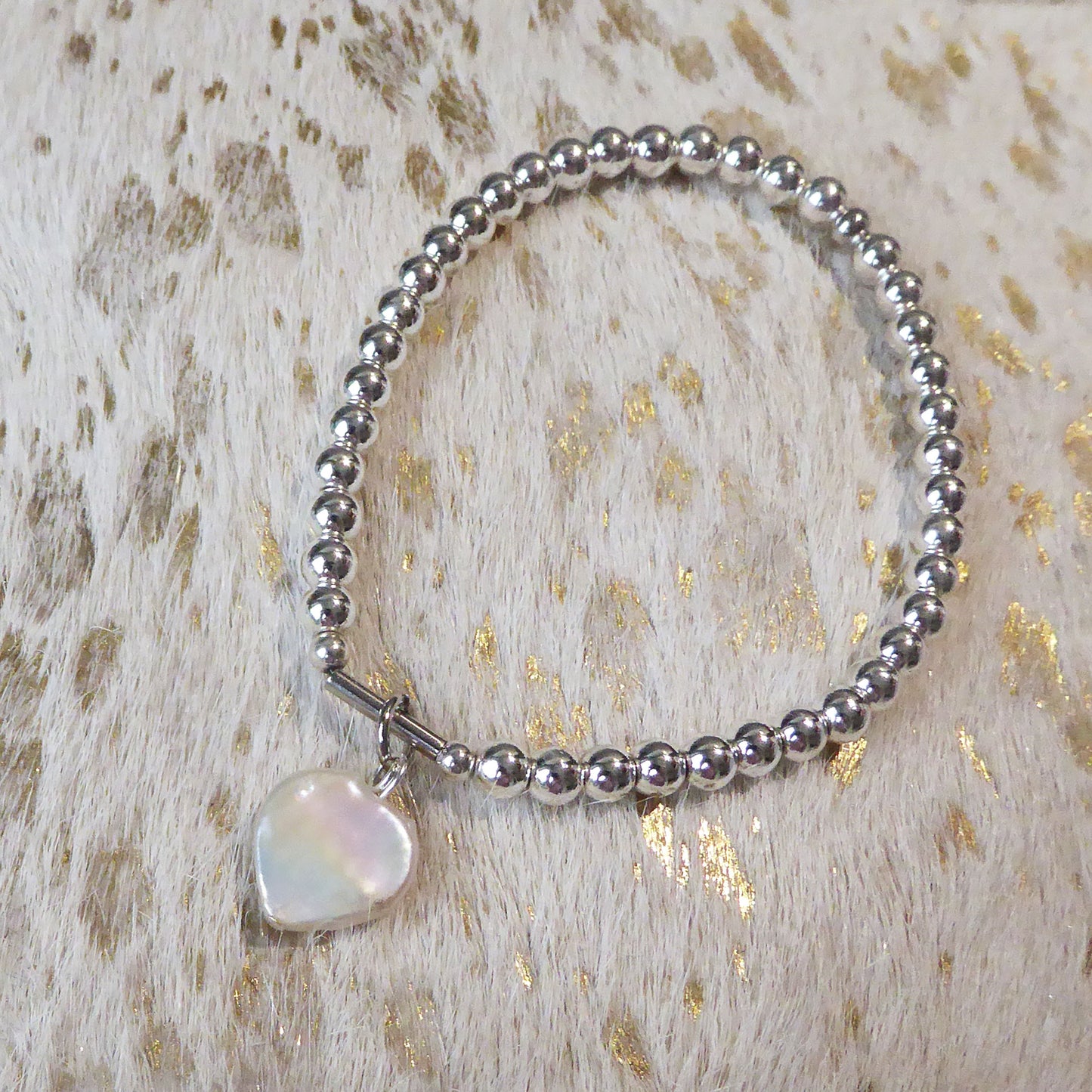 Freshwater pearl heart on silver plated hematine bracelet