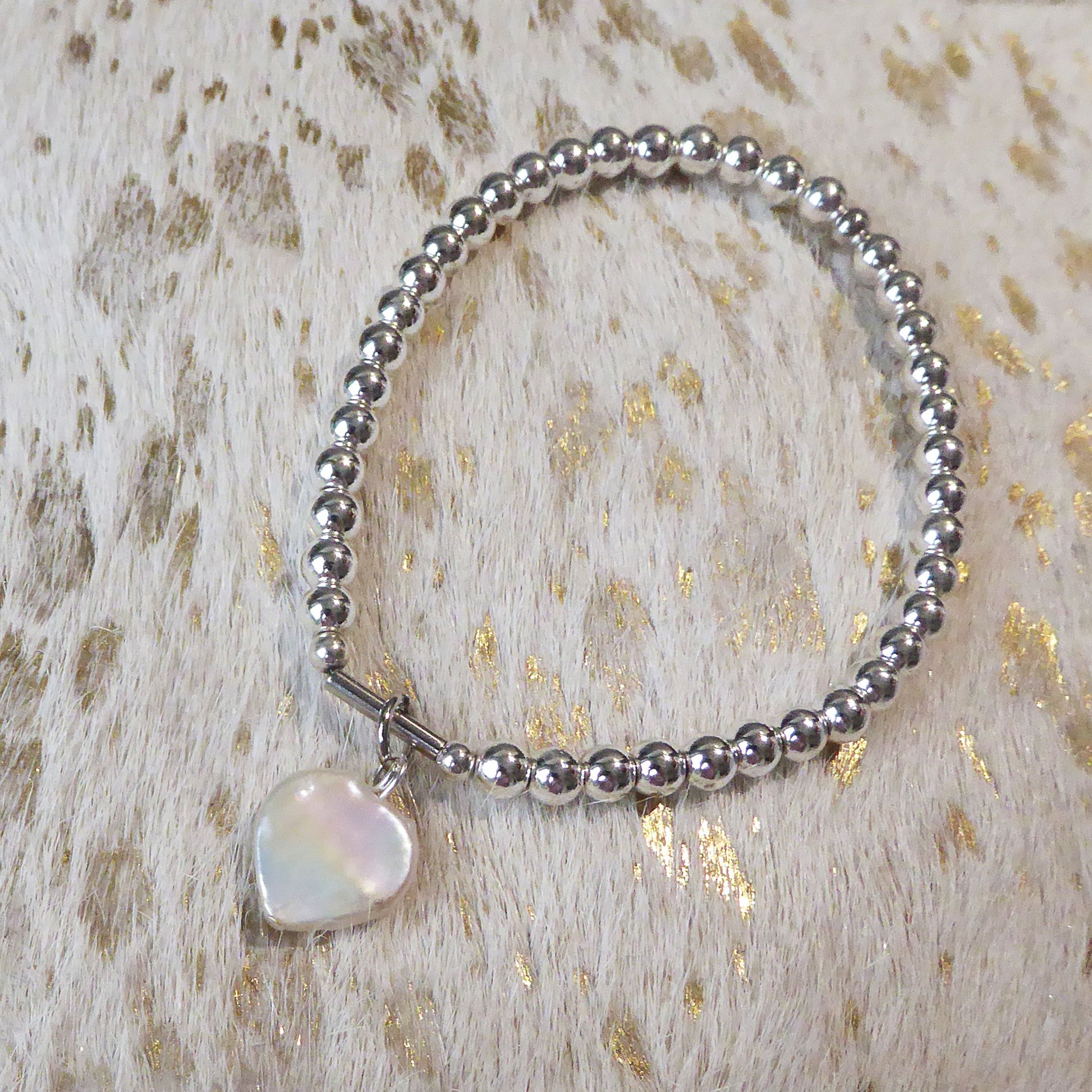 Freshwater pearl heart on silver plated hematine bracelet