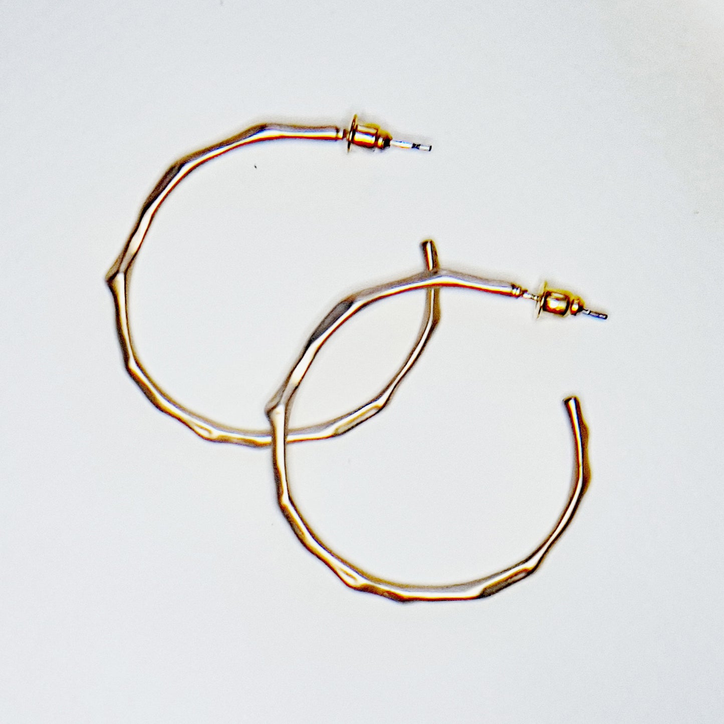 Gold plated hoop earrings of a bamboo design