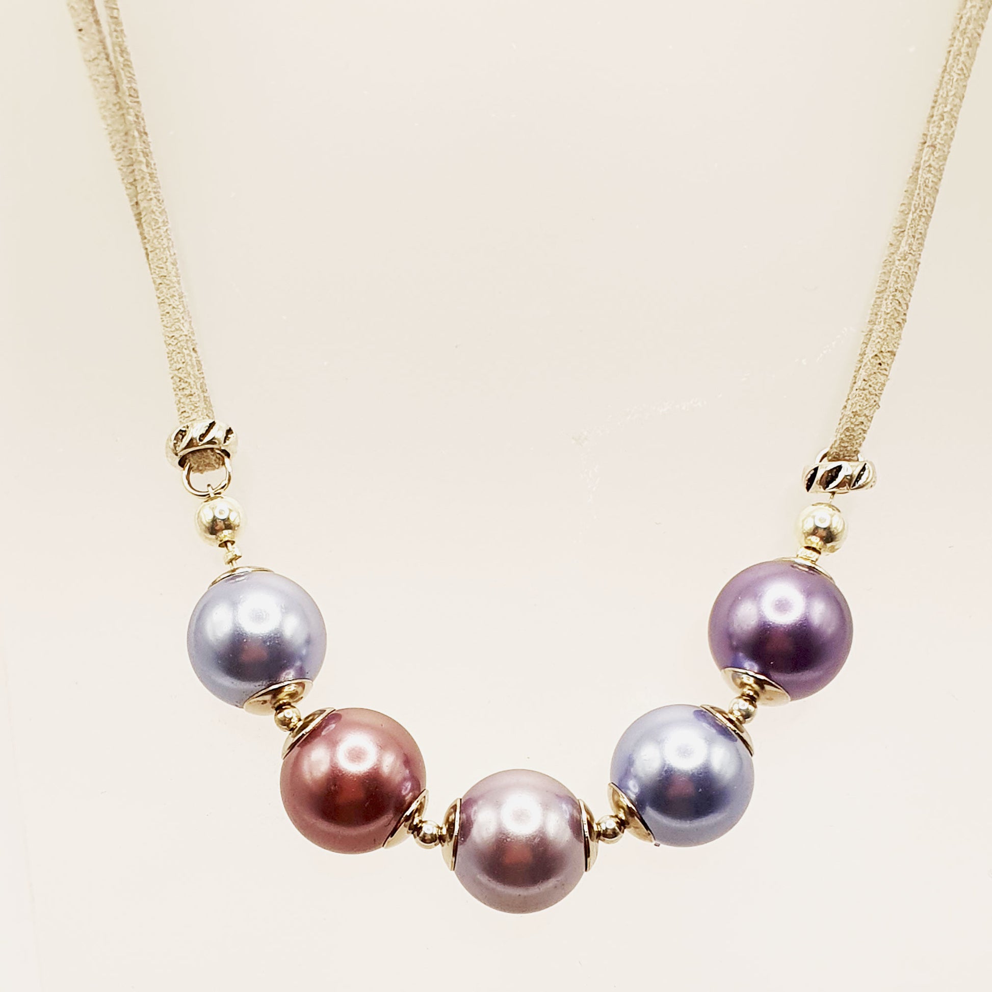 Glass pearl crescent necklace in purple and bronze tones