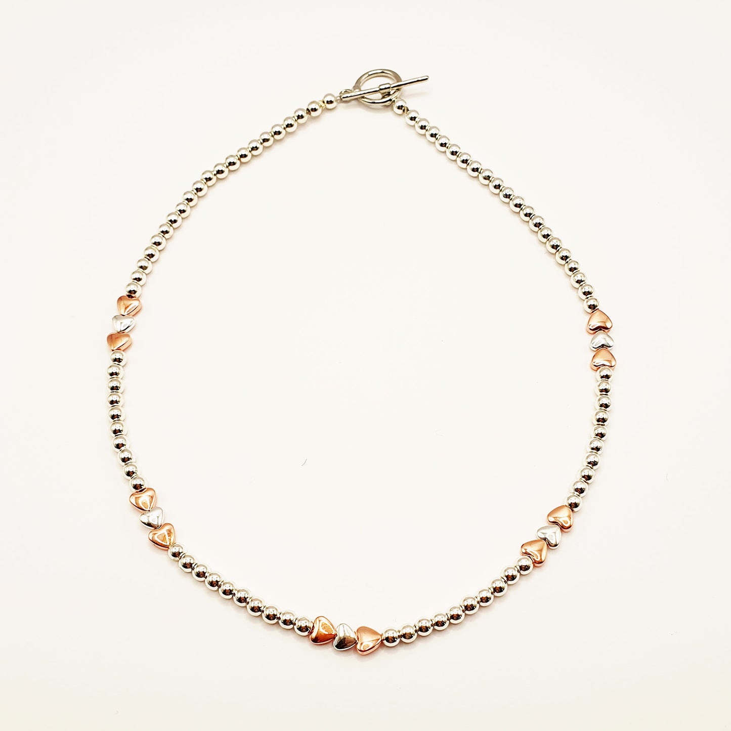 Silver and gold plated hematine hearts necklace