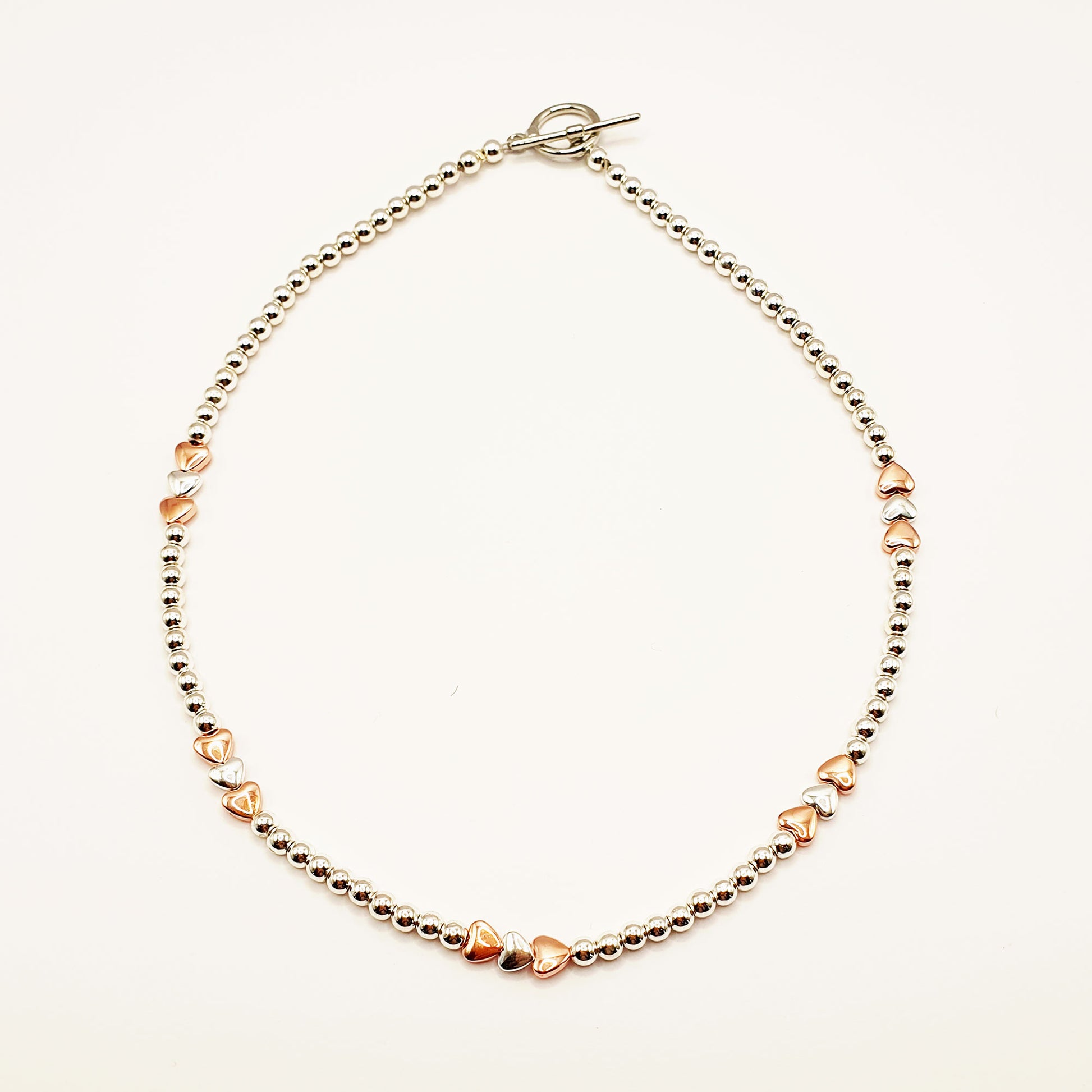 Silver and gold plated hematine hearts necklace