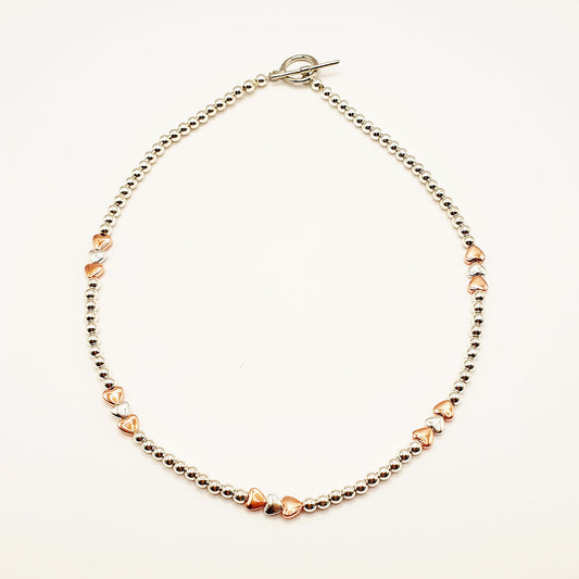 Silver and gold plated hematine hearts necklace