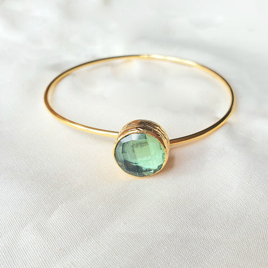 Faceted green glass single stone gold plated stacking bangle