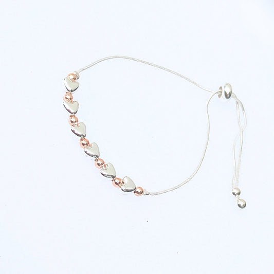 Silver and gold plated hearts slider bracelet 