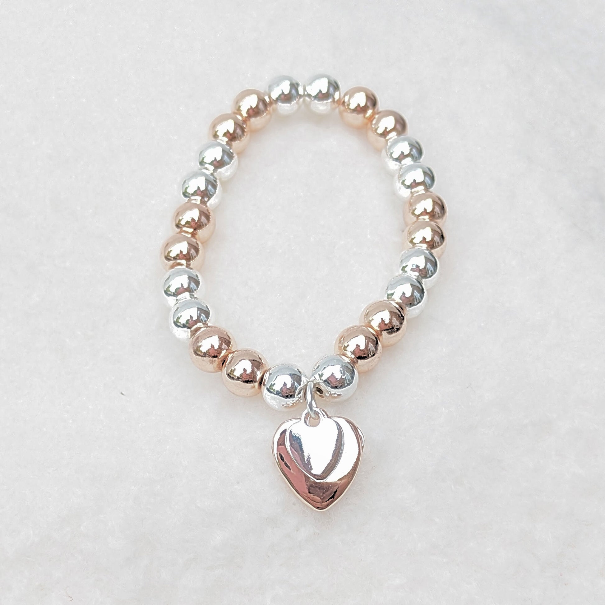 Silver and gold plated heart charm bracelet