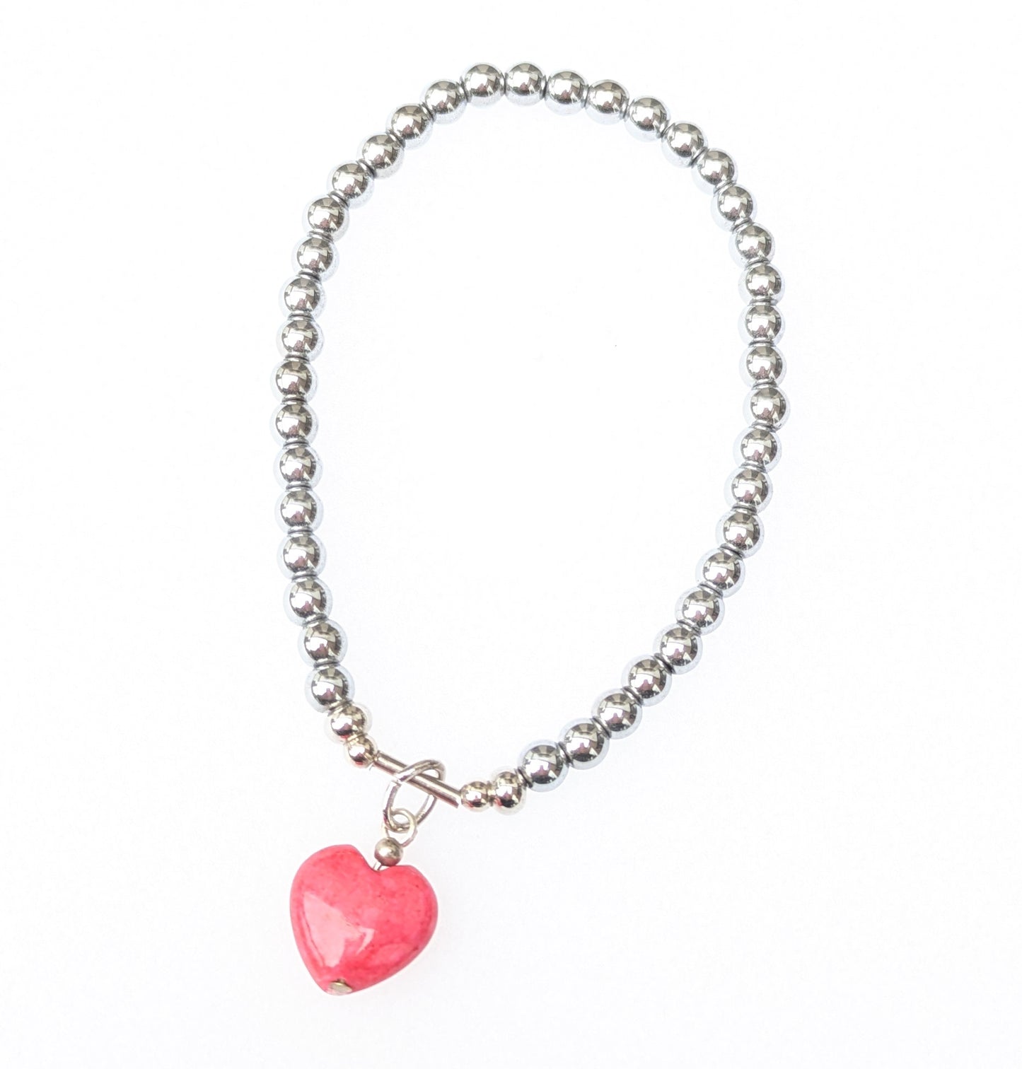 Deep coral fossil heart charm bracelet