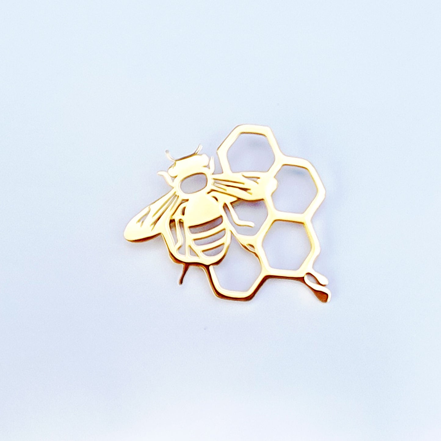 Bee and honeycomb brooch