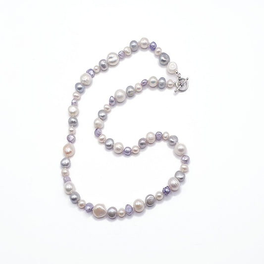 Freshwater pearl mix necklace of white, silver and lavender pearls on a silver clasp