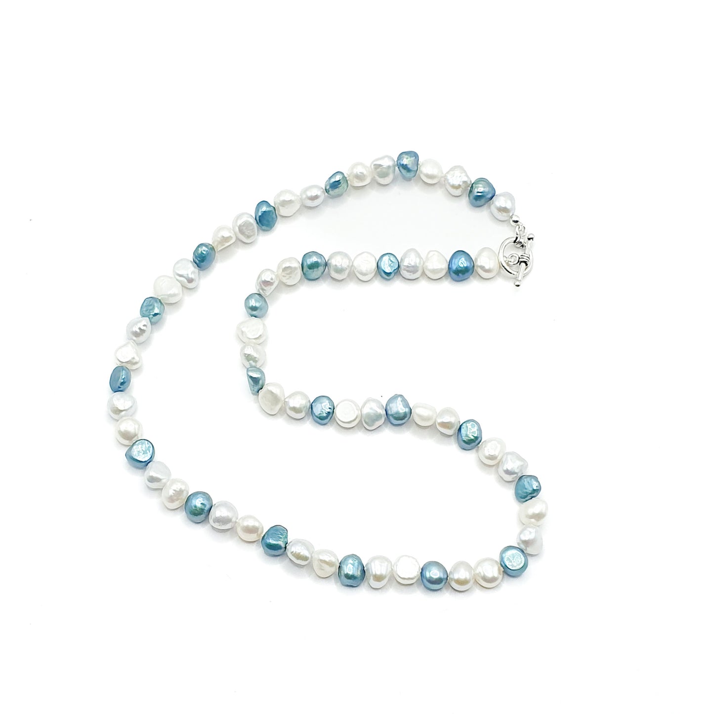 Freshwater pearl mix necklace of white, silver and blue pearls on a silver clasp