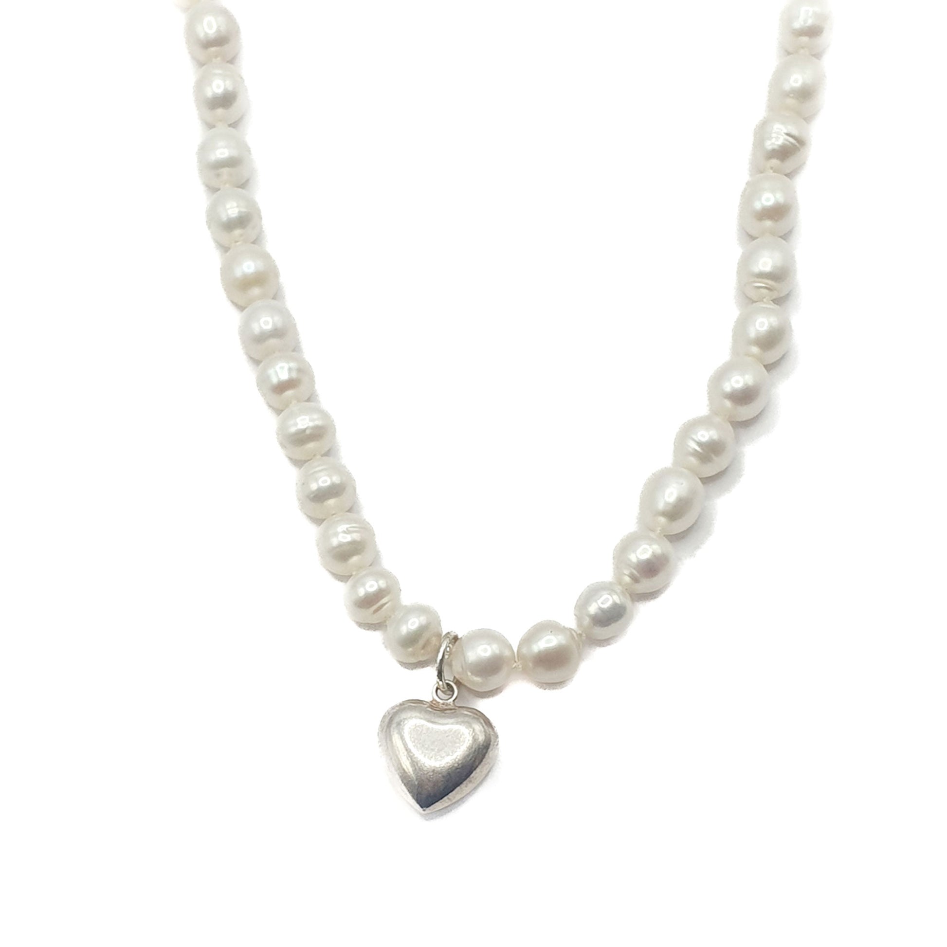 Delicate freshwater pearl necklace in white with a sterling silver puff heart