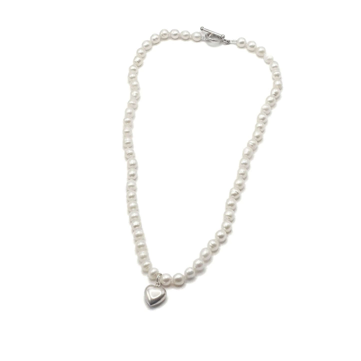 Delicate freshwater pearl necklace in white with a sterling silver puff heart
