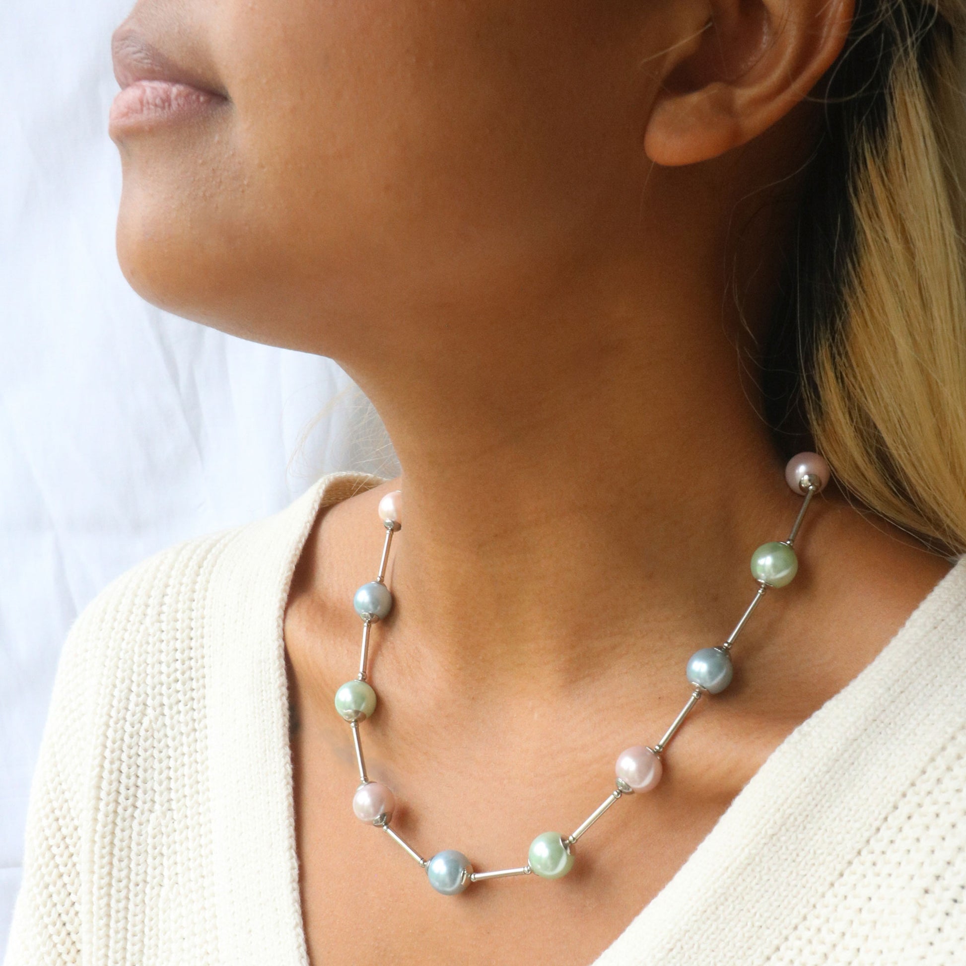 Glass pearl orb-style necklace in pastel shades of blue, pink and green