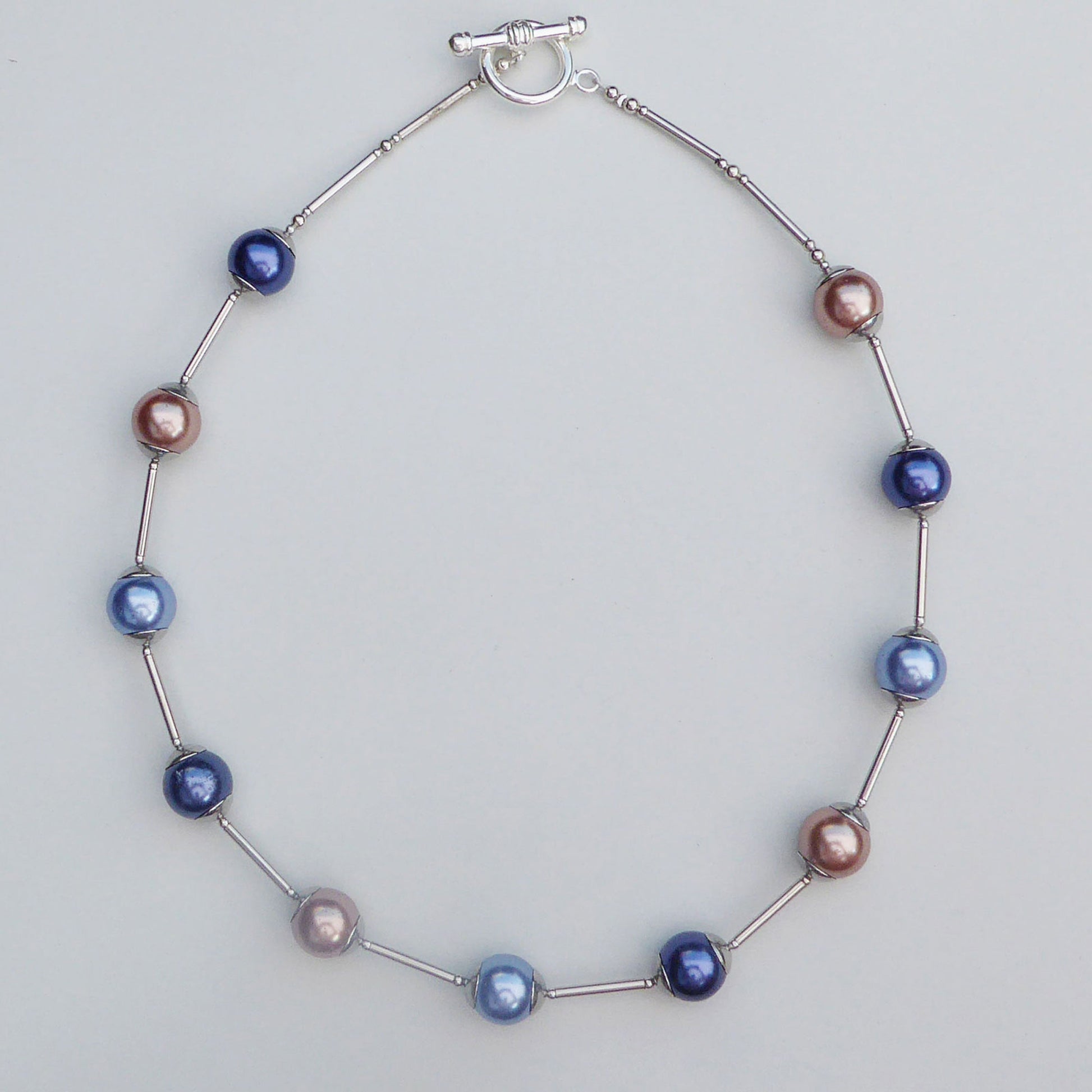 Glass pearl orb-style necklace in blues and brown