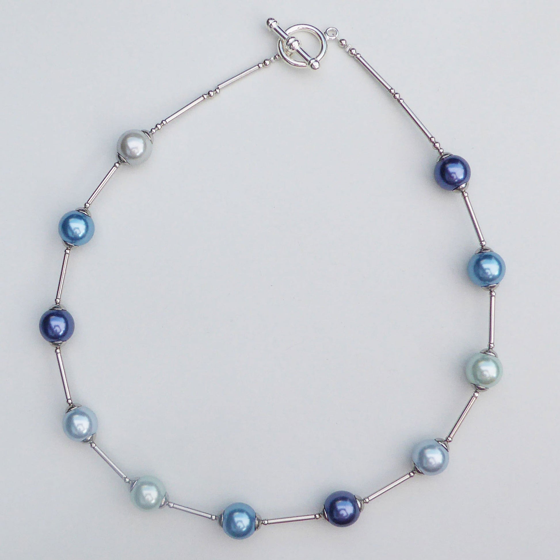 Glass pearl orb-style necklace in blue shades