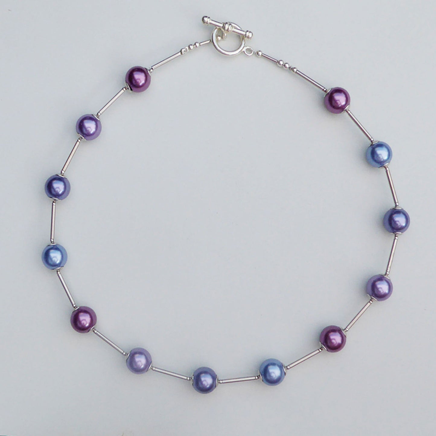 Glass pearl orb-style necklace in shades of purple