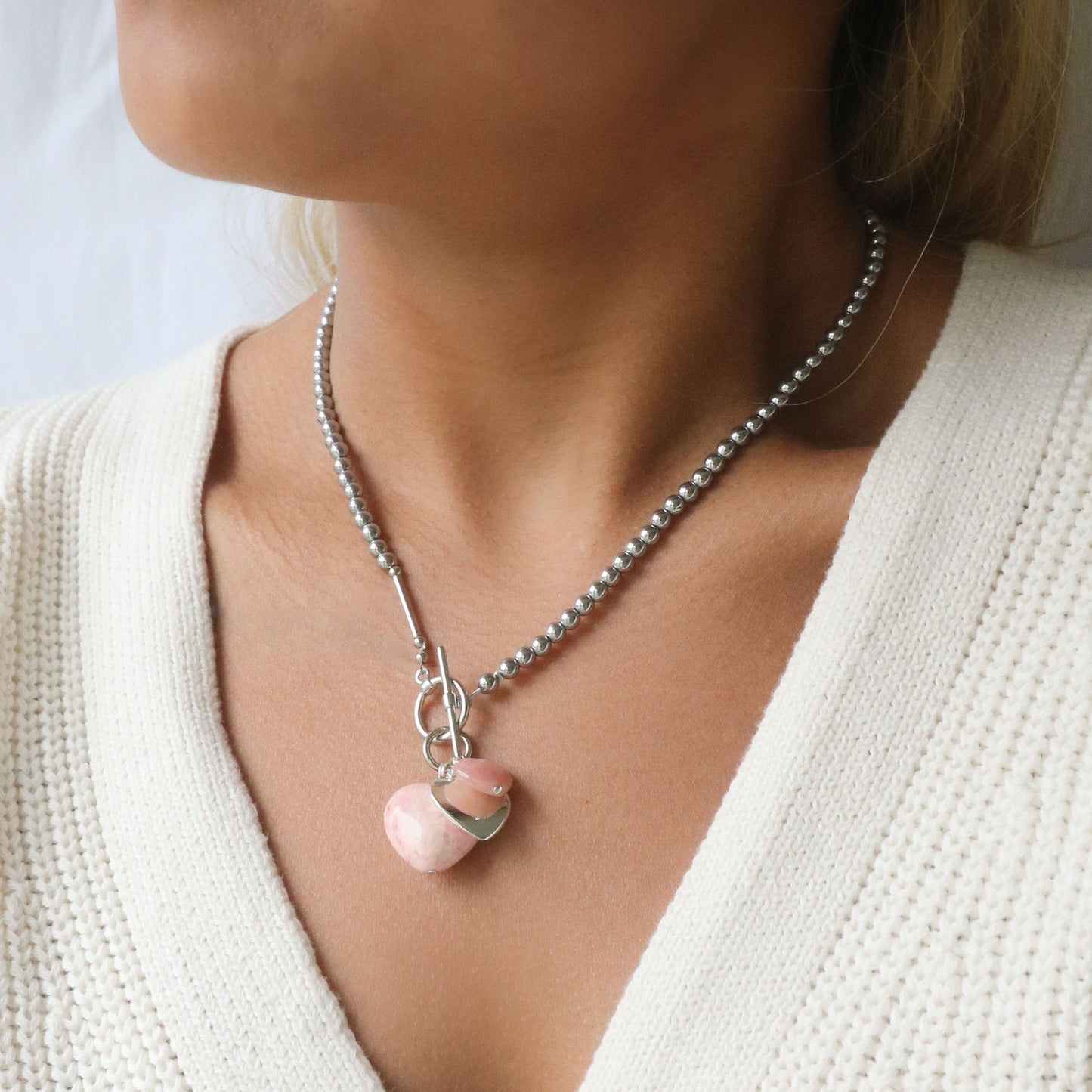 Pale pink fossil stone charms necklace