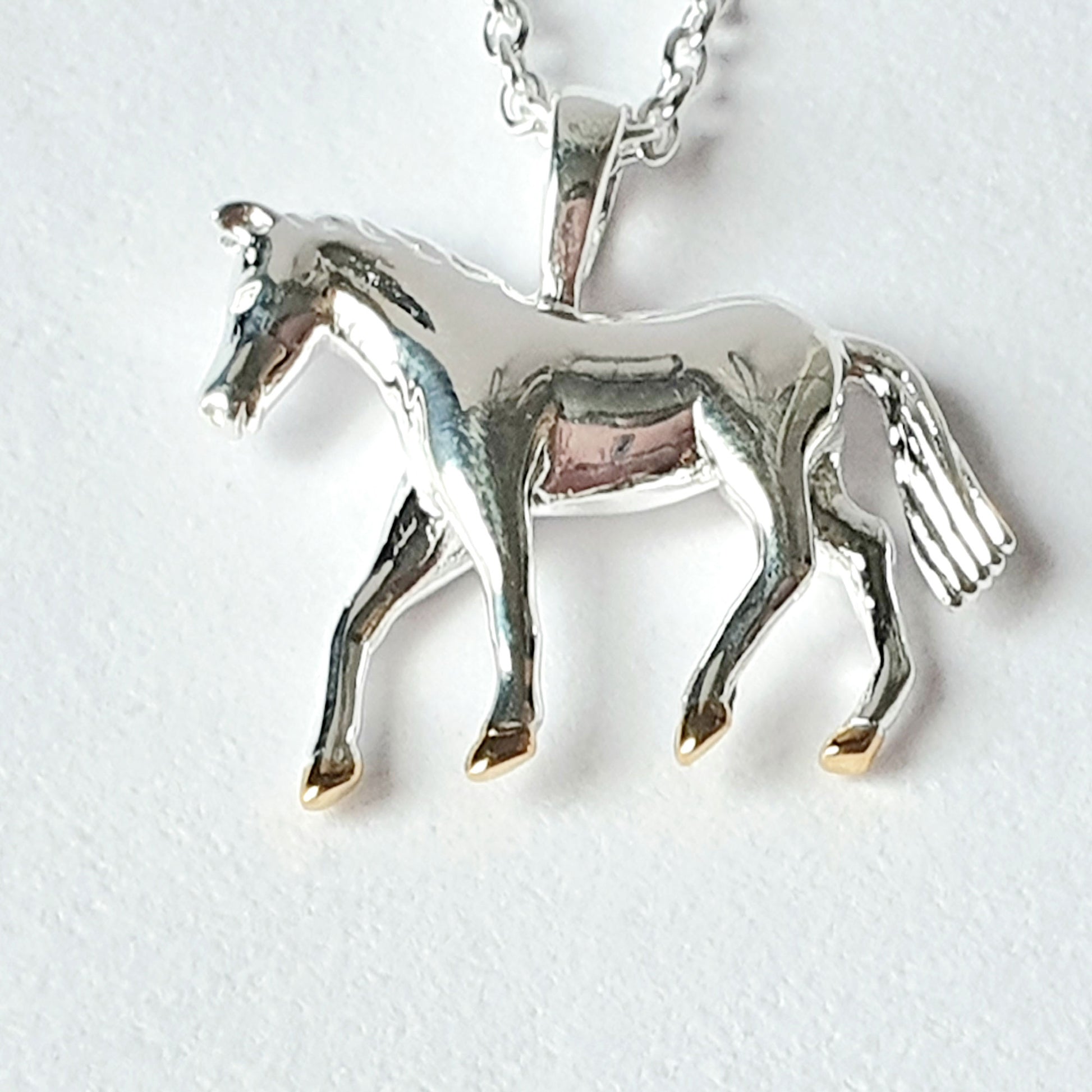 Sterling silver horse with gold vermeil hooves