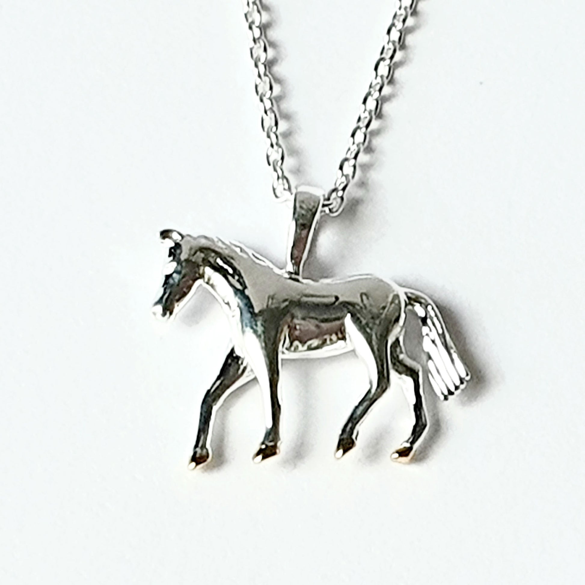 Sterling silver horse with gold vermeil hooves