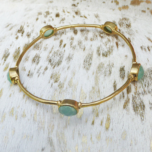 Brass bangle set with faceted chalcedony