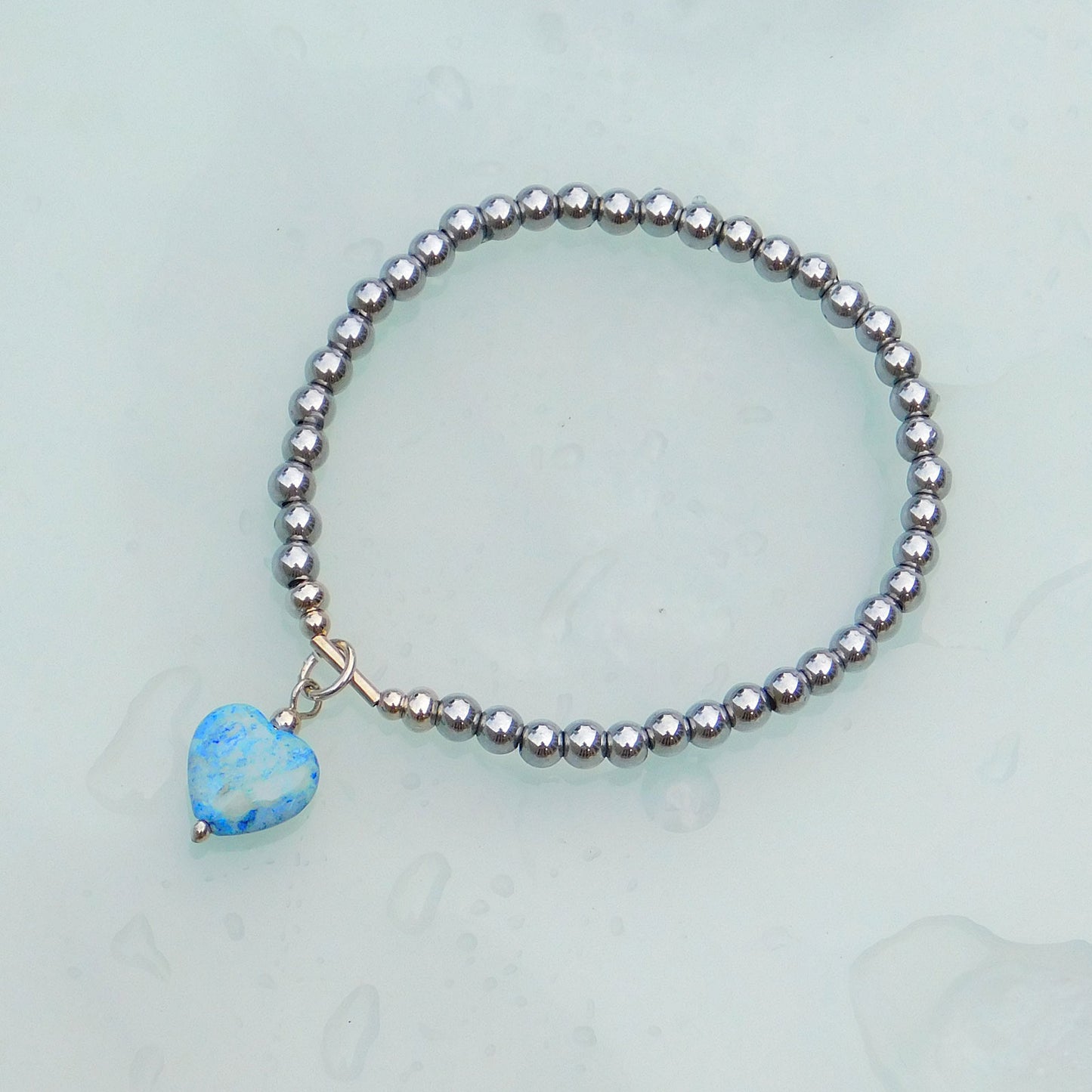 Blue fossil heart charm bracelet