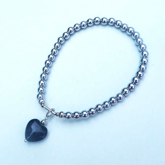 Black fossil heart charm bracelet