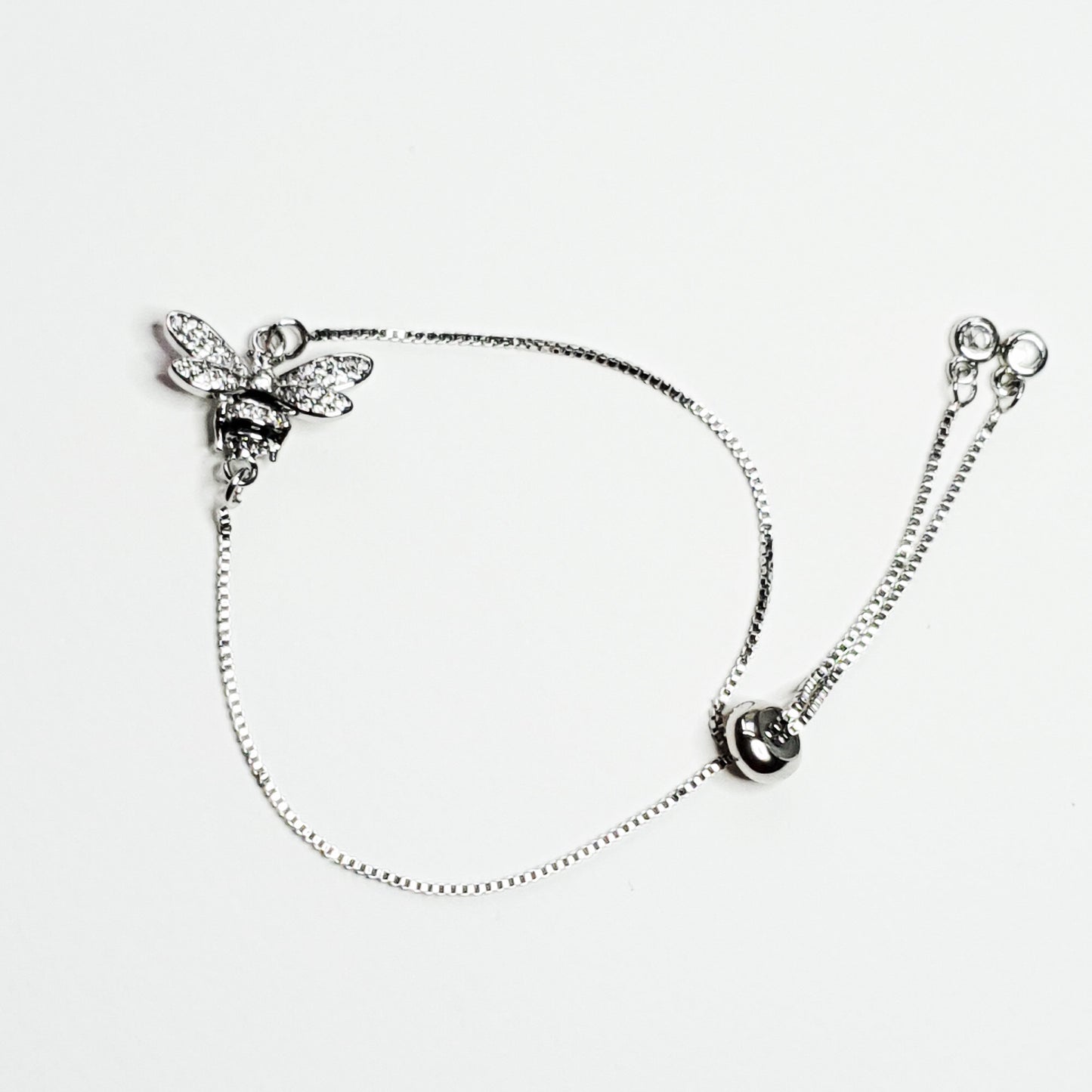 Silver plated bee charm set on a plated chain with an adjustable slider clasp