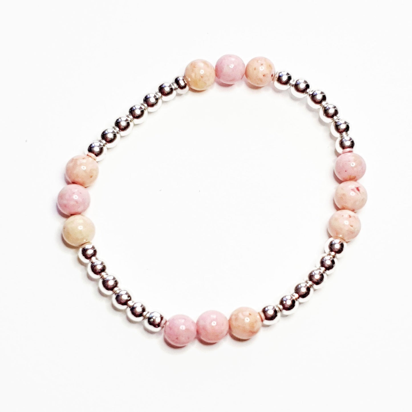 Hematine & fossil ball bracelet in pale pink