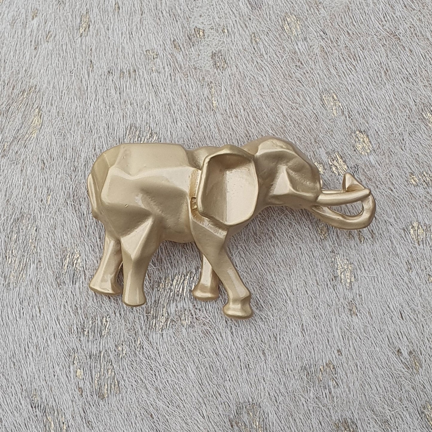 Gold coloured origame effect elephant brooch