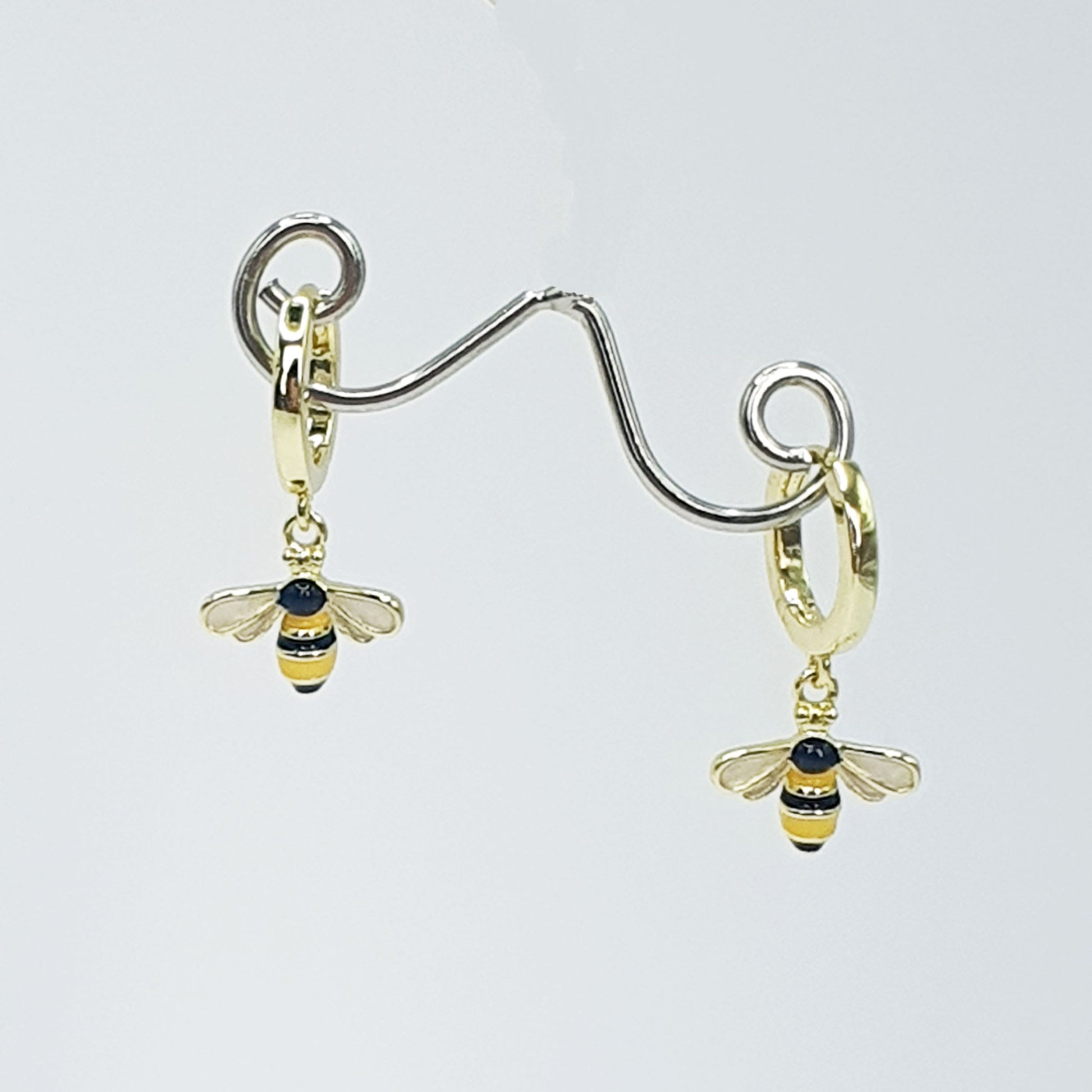 Black & yellow enamelled bees on gold plated hoops