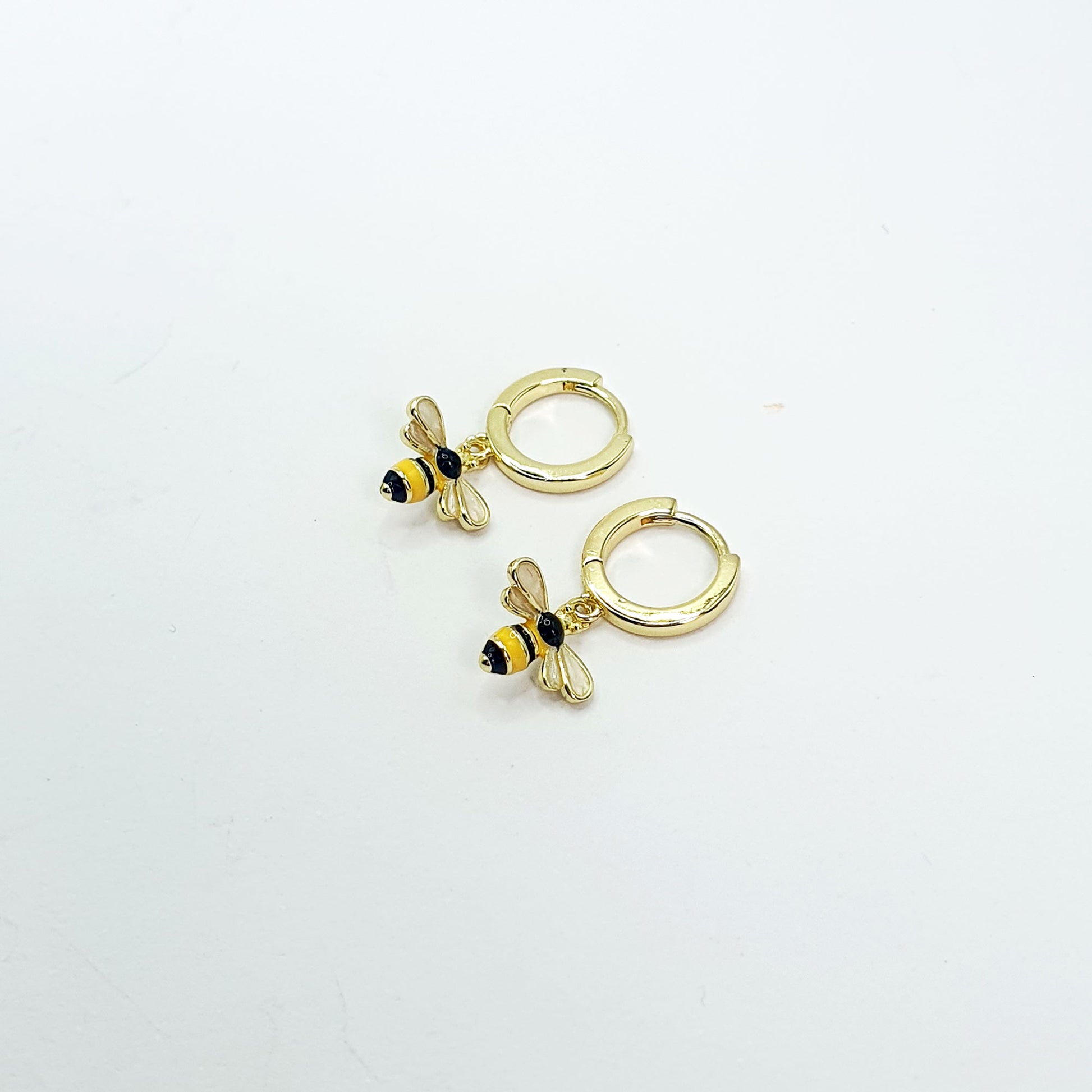 Black & yellow enamelled bees on gold plated hoops