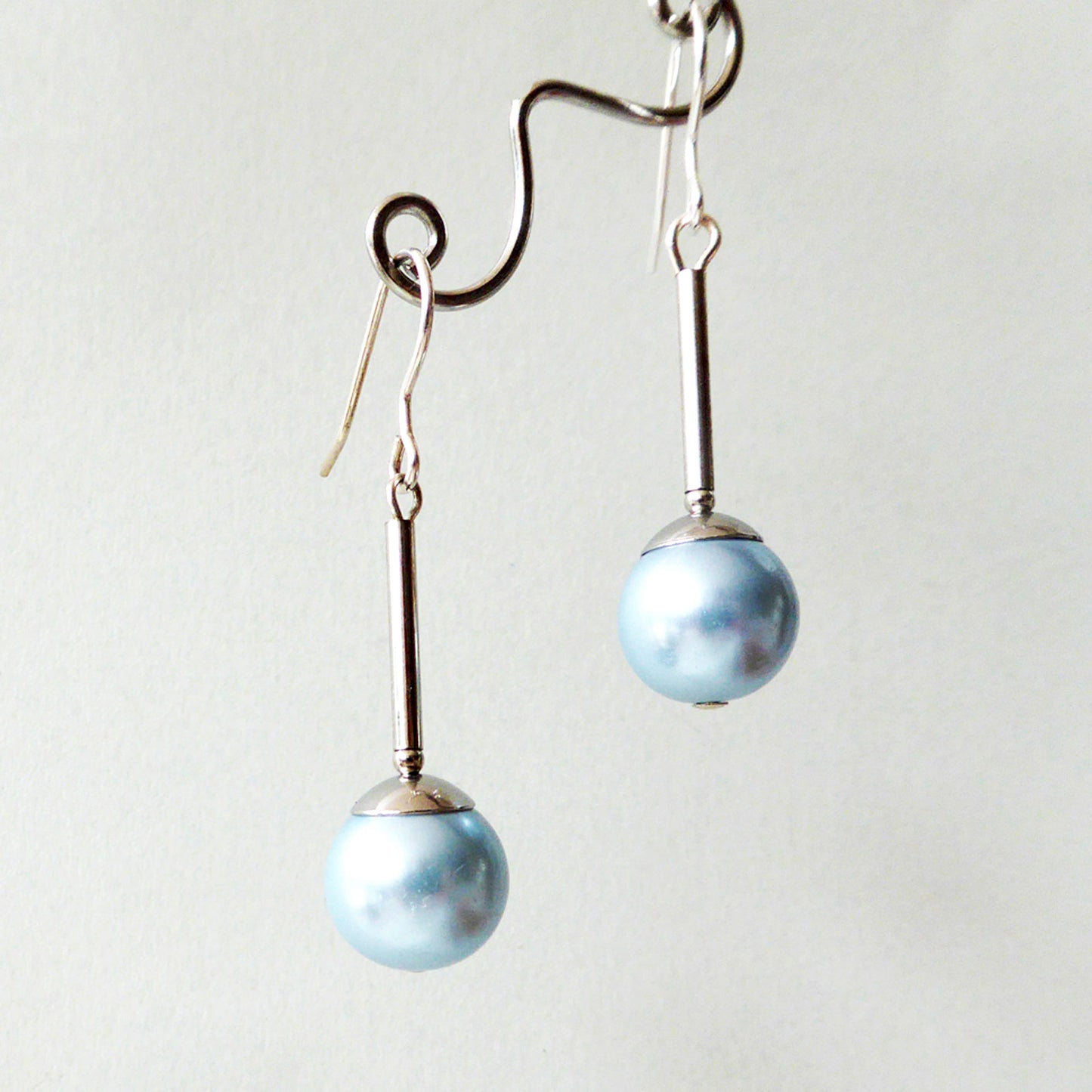 Ice blue glass pearl long drop earrings