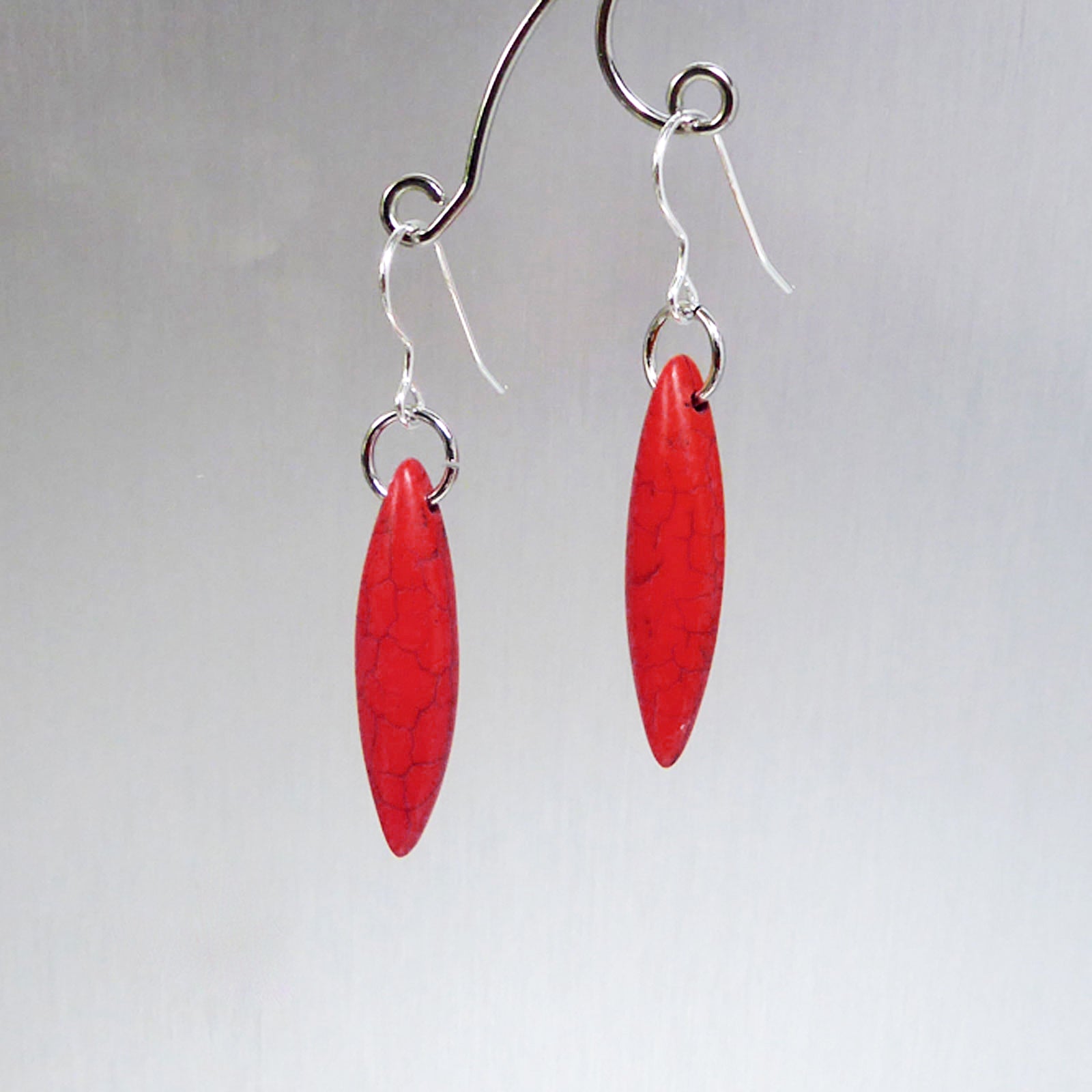 Red elliptical howlite earrings