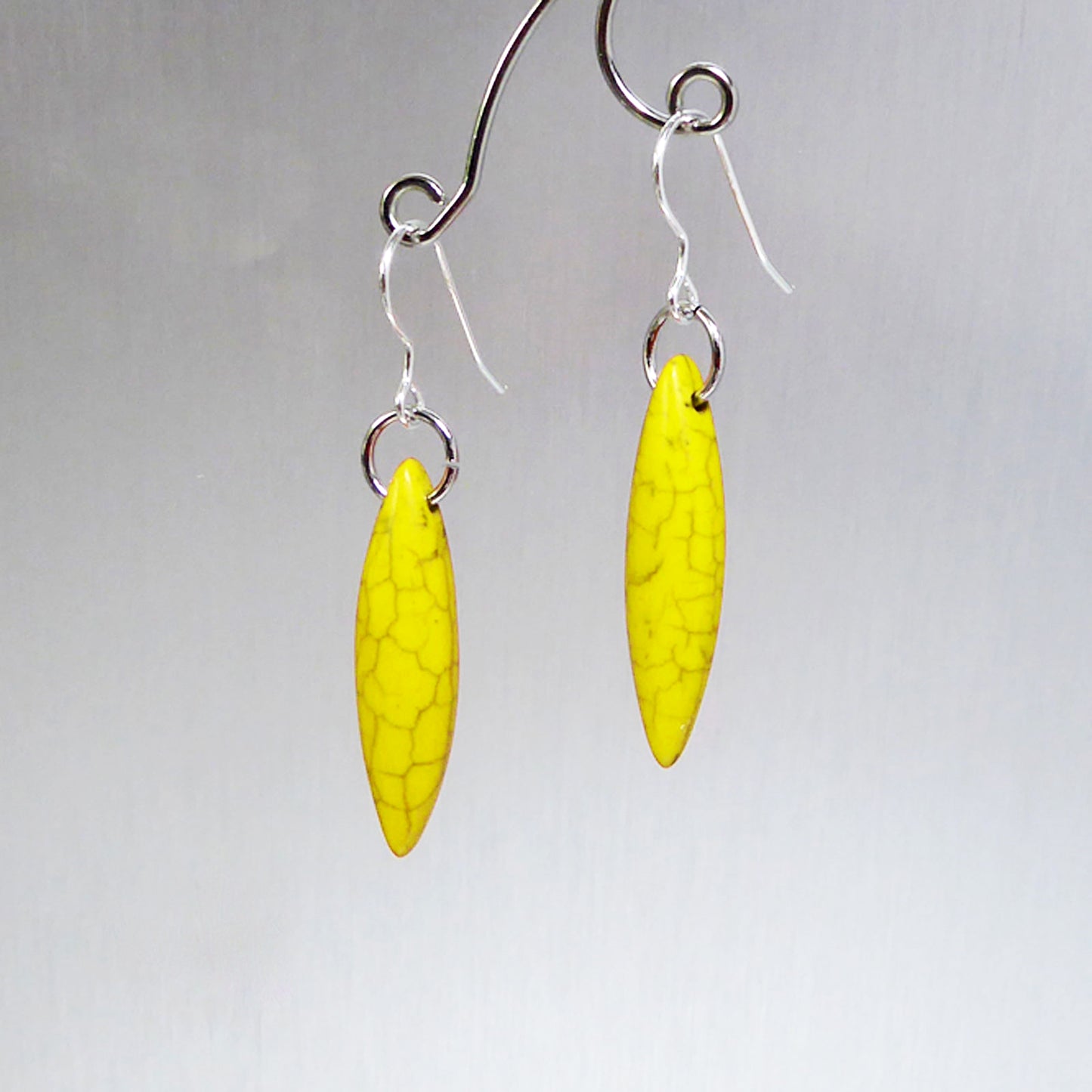 Yellow elliptical howlite earrings