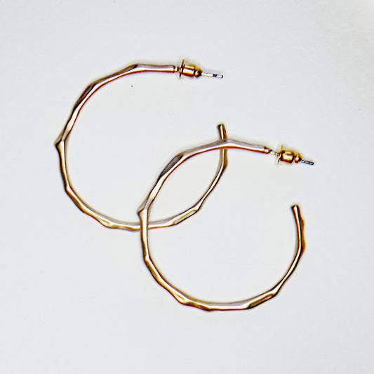 Gold plated hoop earrings of  a bamboo design