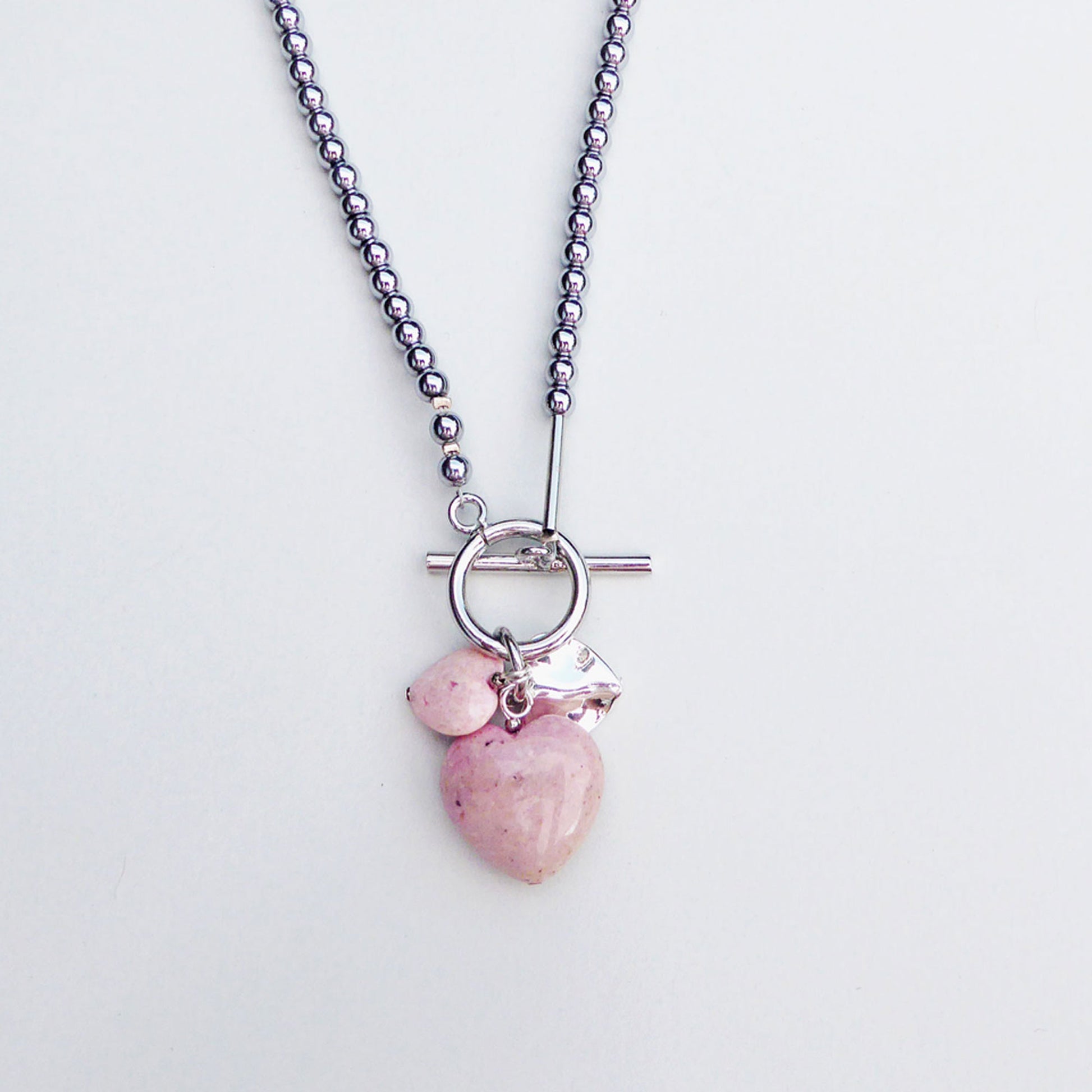 Pale pink fossil stone charms necklace