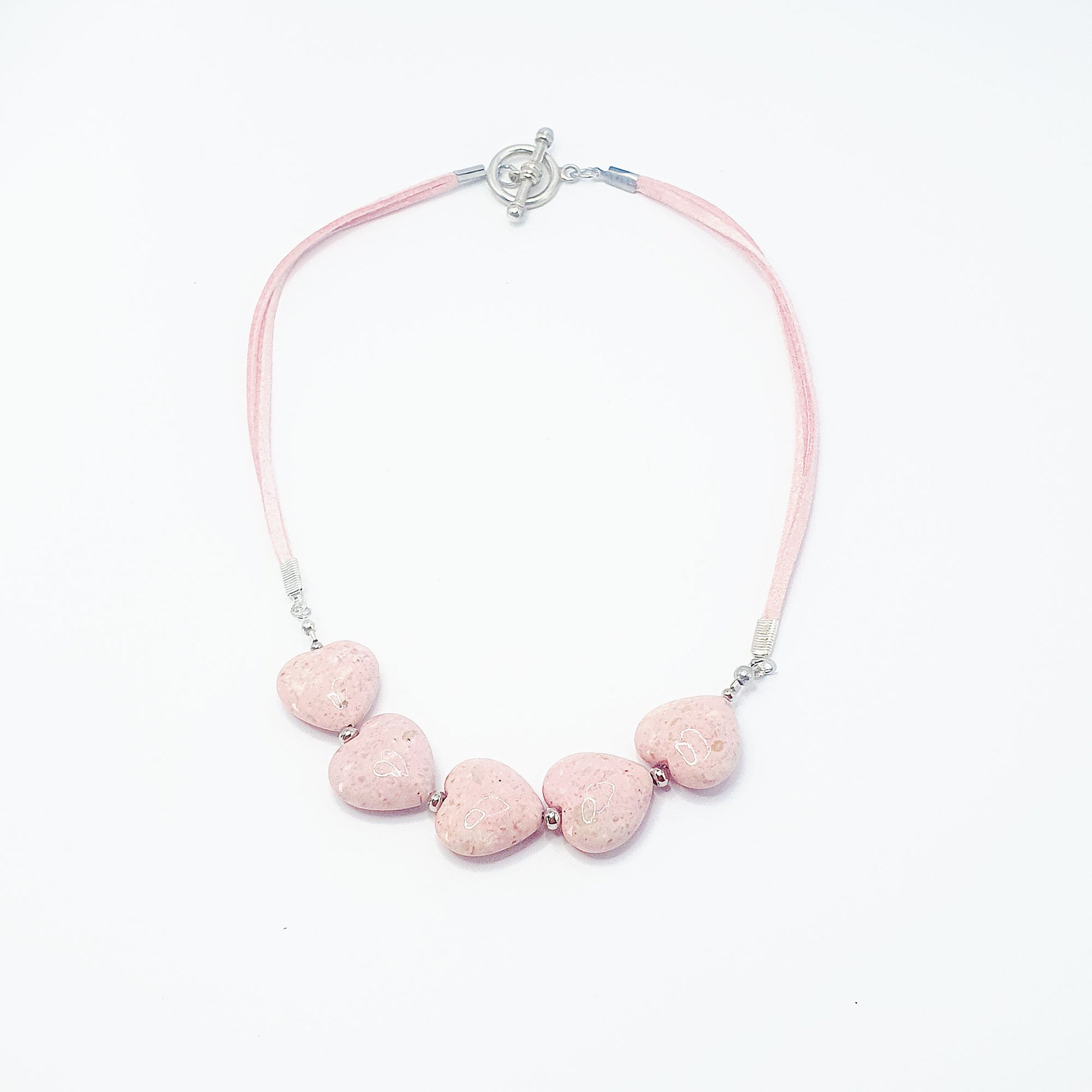 Fossil heart necklace in pale pink